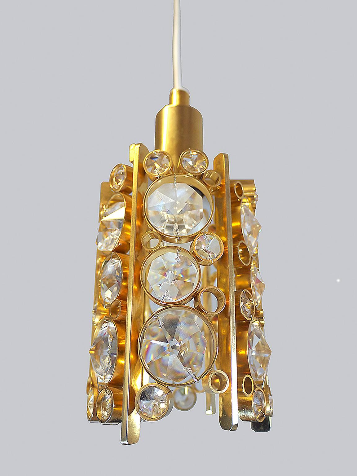 Petite gilt brass chandelier with faceted Swarovski crystals. Manufactured by Palwa, Germany in the 1960s. 

Lighting: takes one small Edison E14 base screw bulb. 
Wattage: we recommend up to 40w per bulb. Works on 220v as well as 110v. 
Condition: