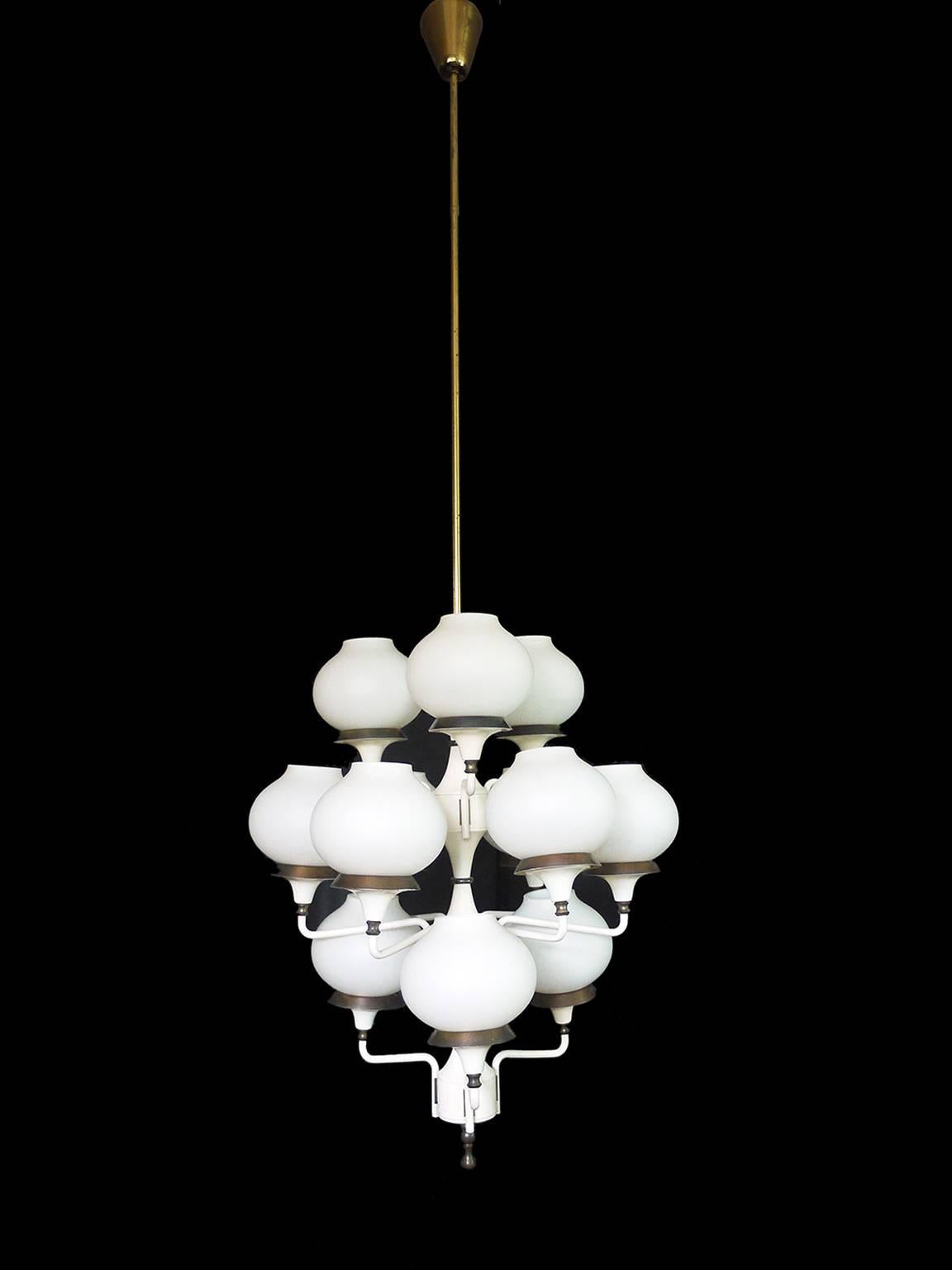 Elegant chandelier with 12 overlay satin glass globes on a white lacquered metal frame with brass finals. Manufactured by Hans-Agne Jakobsson, Sweden in the 1950s

Design: Hans-Agne Jakobsson. 
Model: Tulipan, Sputnik. 
Style: Mid Century Modern,