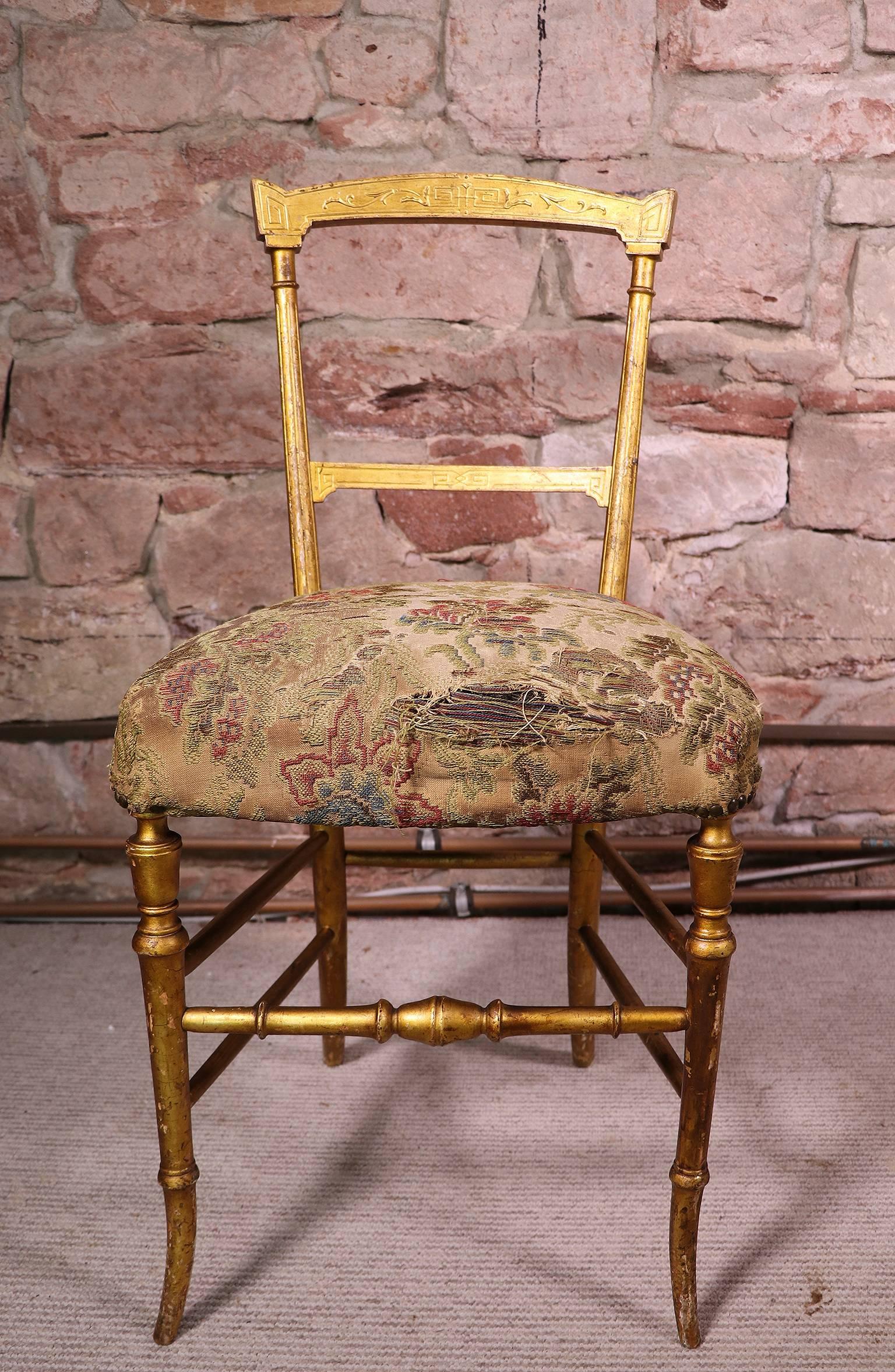 A delicate and elegant antique giltwood Chiavari chair made in Italy in the 19th century.
Original and wonderful naturally aged patination to the giltwood.
With elegant turned legs.
The upholstery should be renewed. 