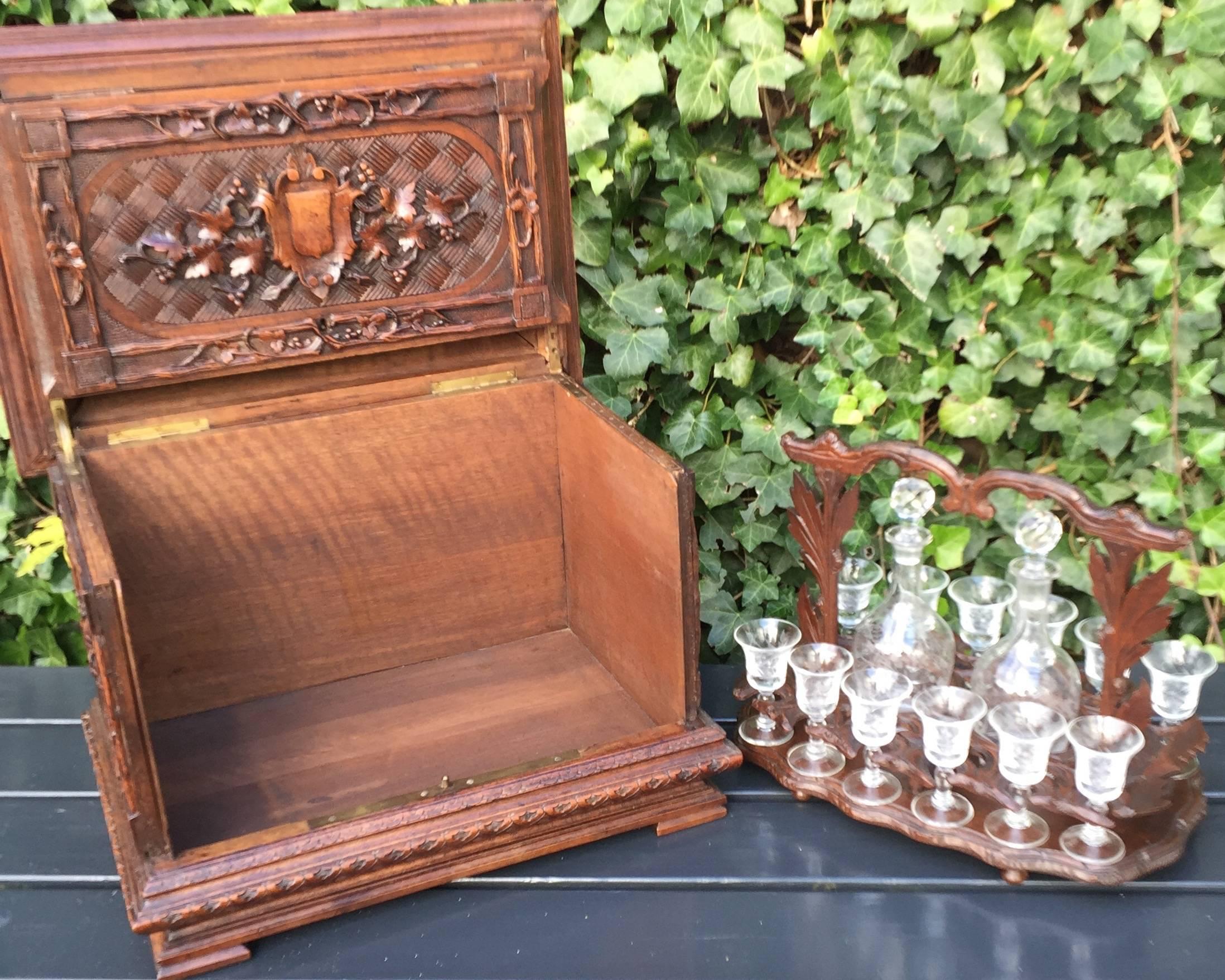 Huge and museum quality hand-carved walnut wood Black Forest art Victorian era liquor tantalus.

This magnificent Black Forest drinks box, dates from circa 1860. The beautiful glasses and decanters are of a later date, bute they go really well with