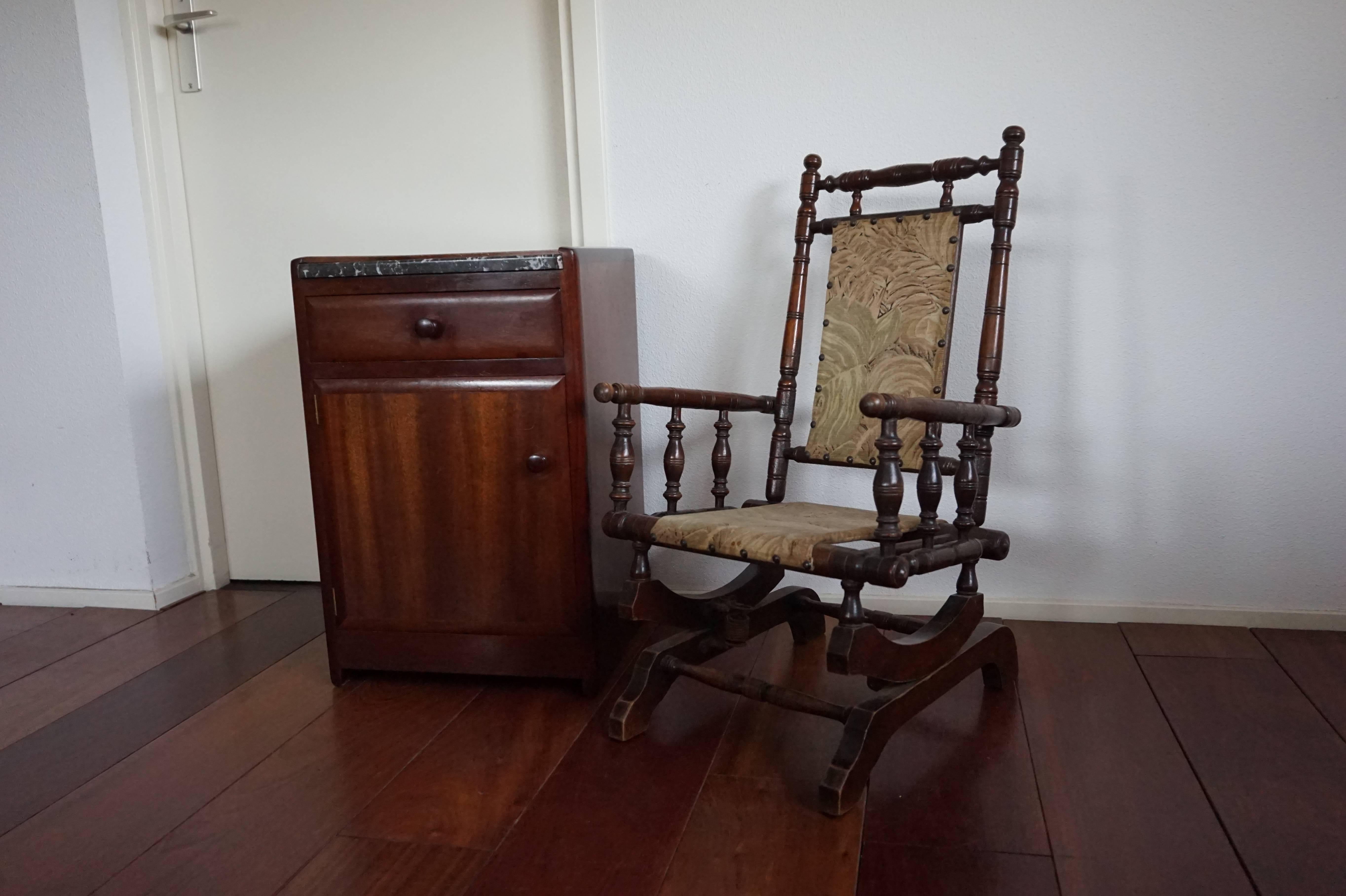 Beautiful and decorative small antique chair.

This handcrafted and rare American rocker for children is made of turned beech wood and it is in amazing condition. This stunning and extremely decorative little chair dates from circa 1880-1890 and it