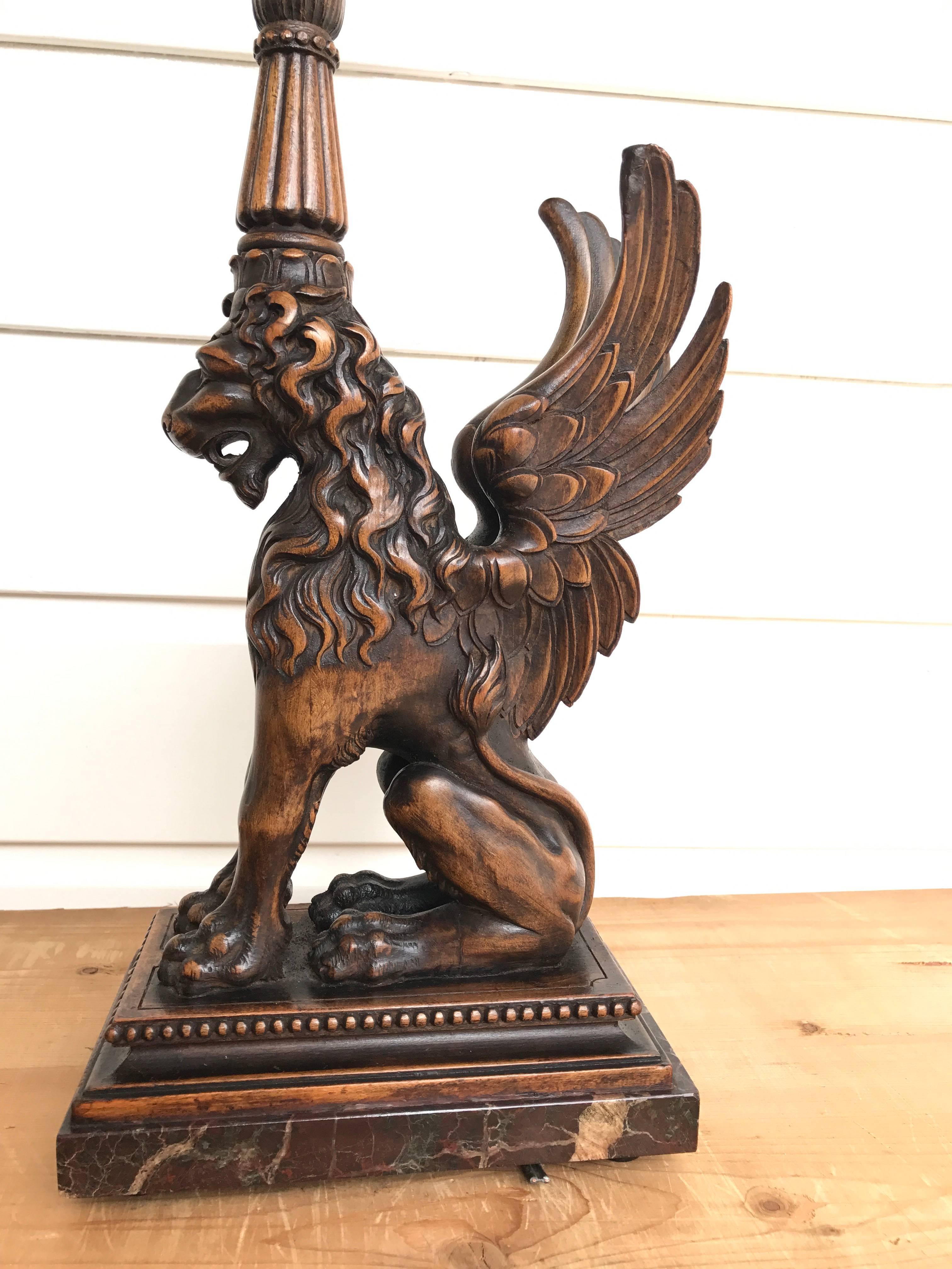 Decorative and highly stylish antique table lamp on a marble base. 

This rare and impressive lion sculpture is beautifully carved out of one piece of nutwood. It is sitting up in a stately manor and his angelic wings make him extra impressive. This