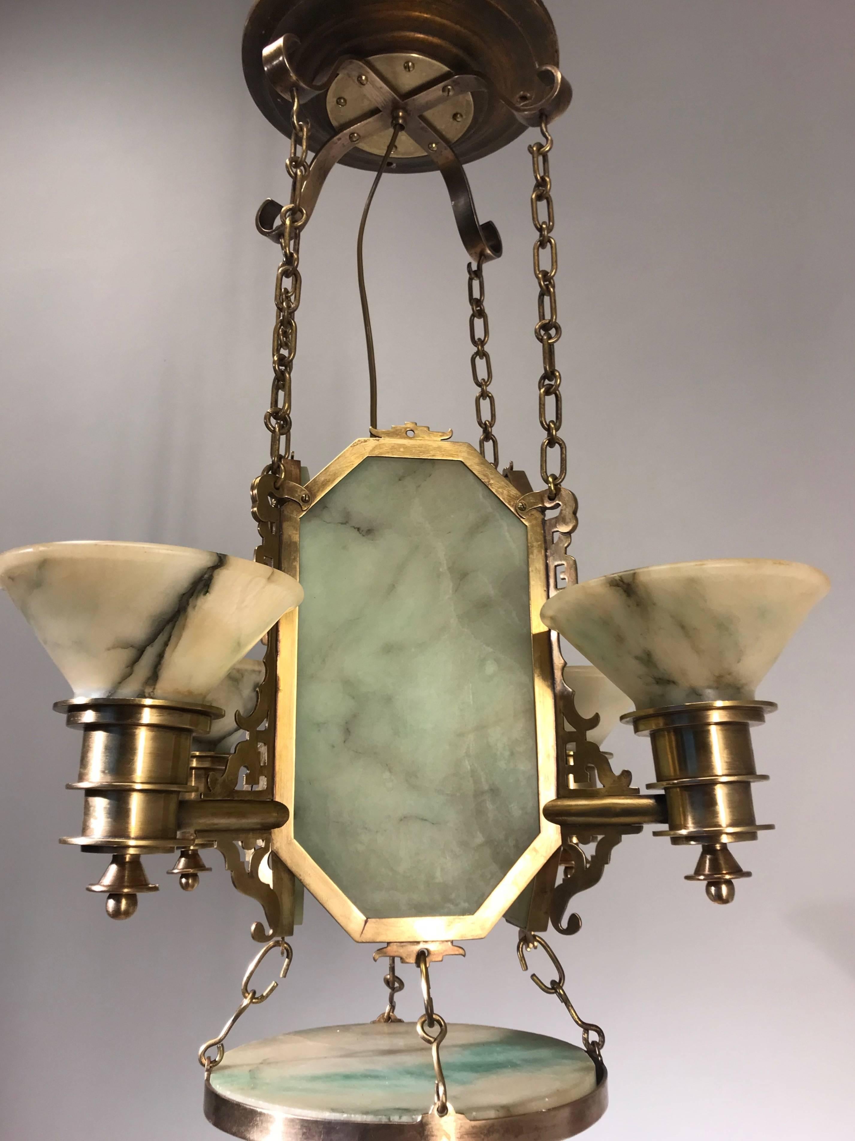 One of a kind, early 1900s Arts & Crafts light fixture.

This antique and extraordinary alabaster pendant is another one of our recent, great finds. The maker of this unique and impressive work of lighting art must have been inspired by Chinese