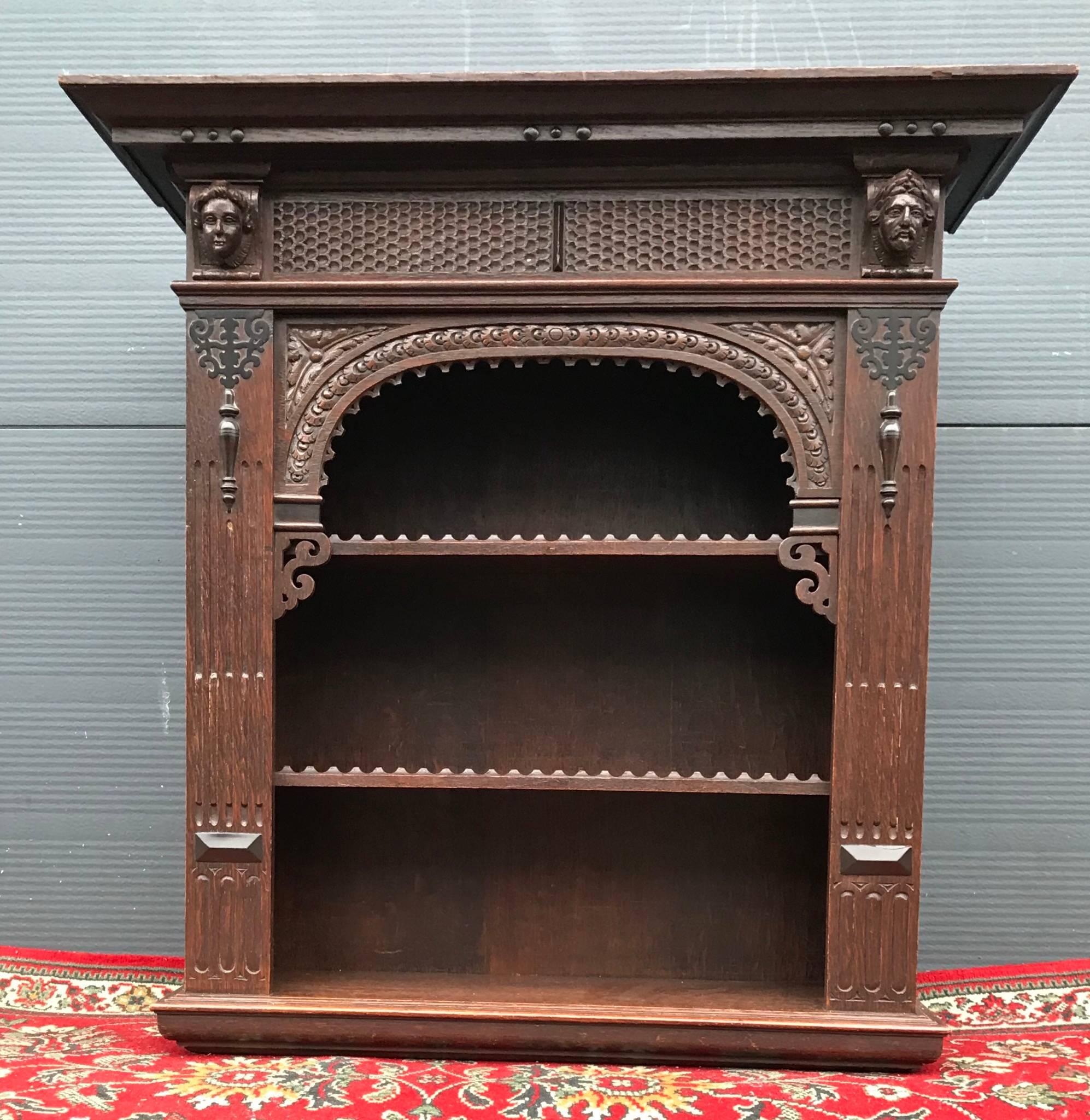 Beautiful handcrafted wall hanging cabinet with height adjustable shelves.

This 19th century open wall cabinet is a handcrafted work of art in its own right and it is in excellent condition. This good sized antique is entirely hand-carved out of