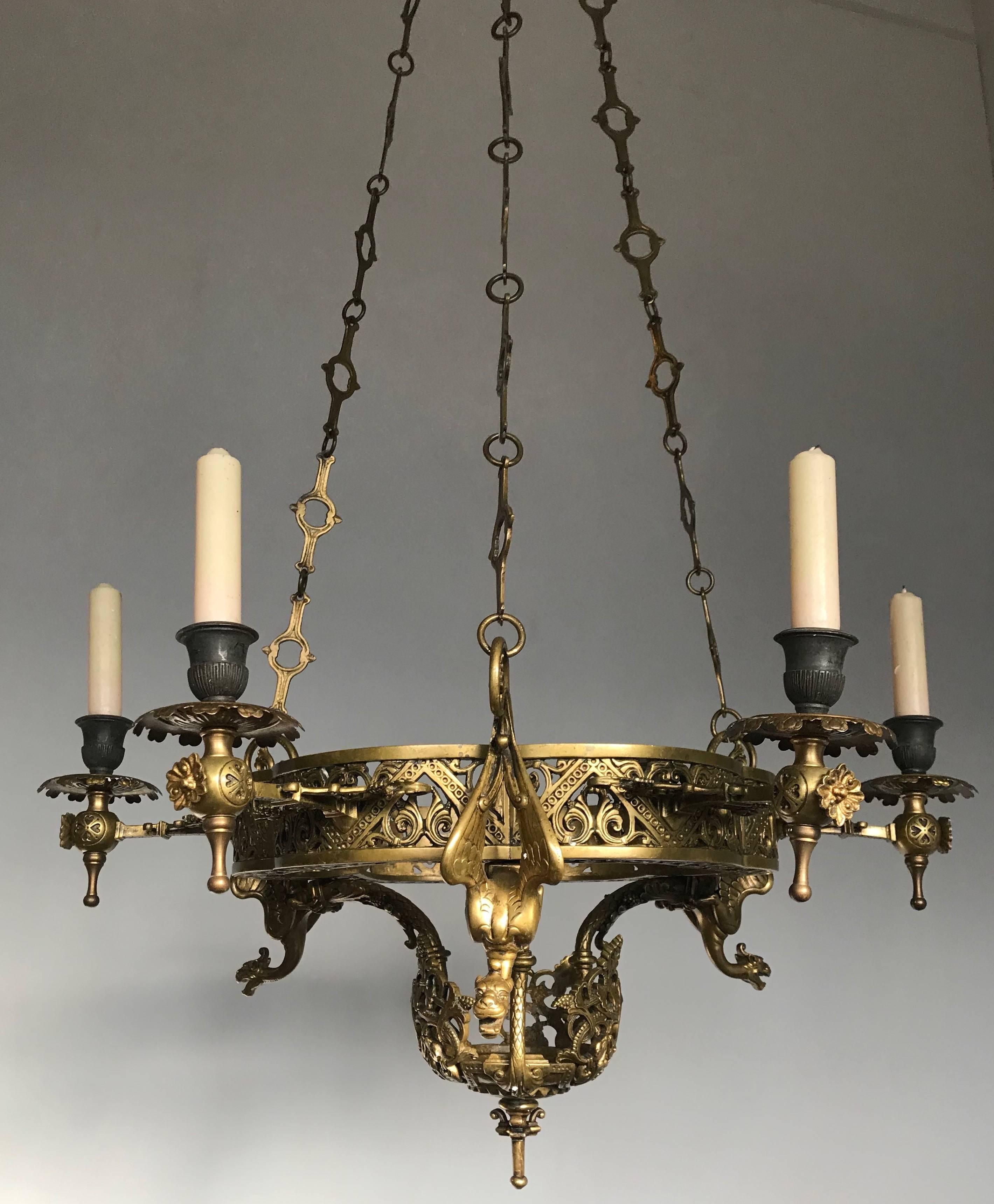 Stunning and early bronze chandelier for candles.

In antiques it very often is the case that how older the piece is, the better the quality and the details. This early, rare and decorative Gothic style chandelier is no exception to that rule. You
