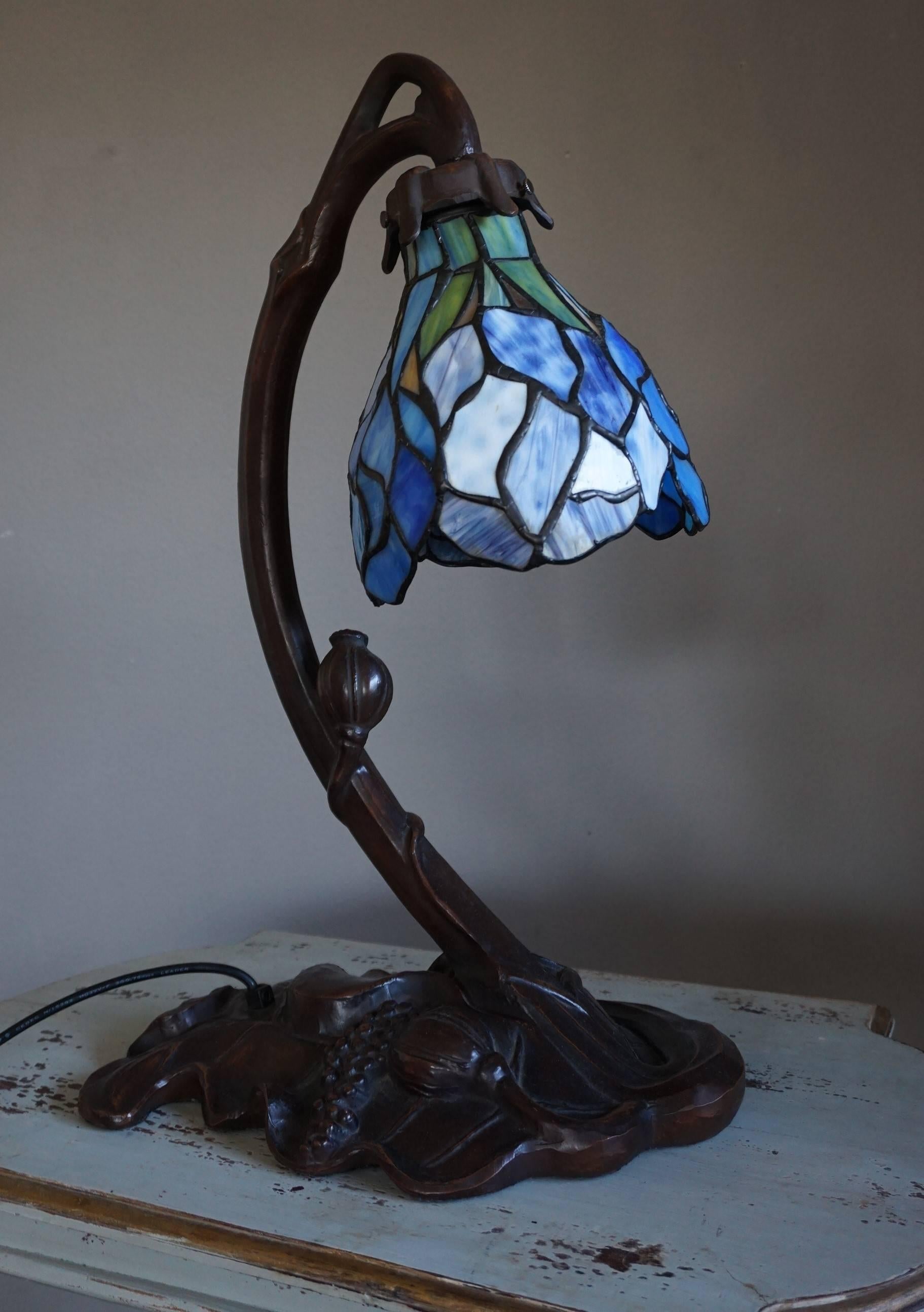 Beautiful shape, colors and condition table lamp.

This elegantly shaped Art Nouveau style table or desk lamp is in excellent condition and it radiates a very organic and calm energy, both on and off. This relatively large and rare example comes