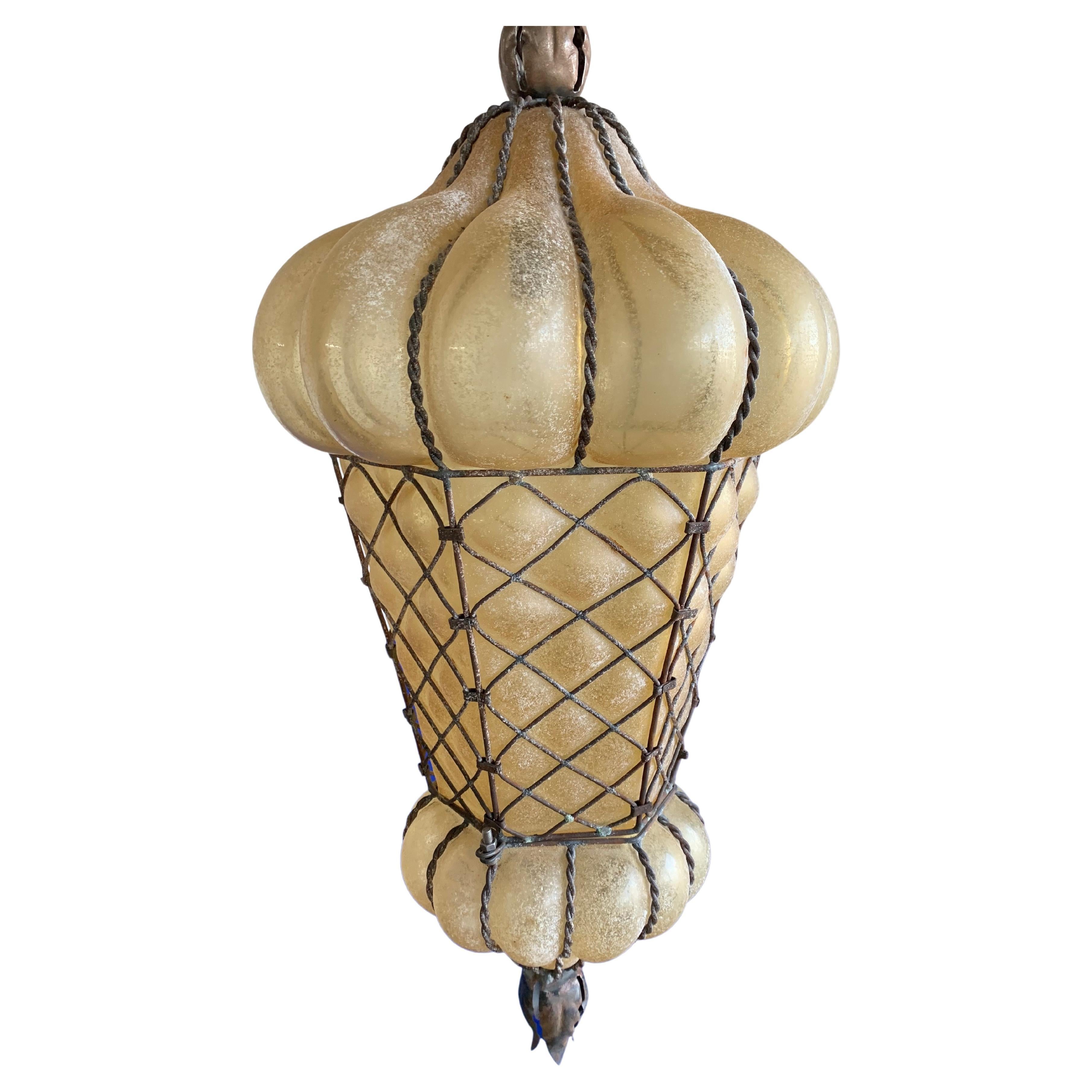 Large, powder colored and great condition Venetian light fixture.

This Midcentury Venetian pendant is not only the largest of it's kind we ever had the pleasure of offering, it also is in exceptional condition. We have completely rewired it for