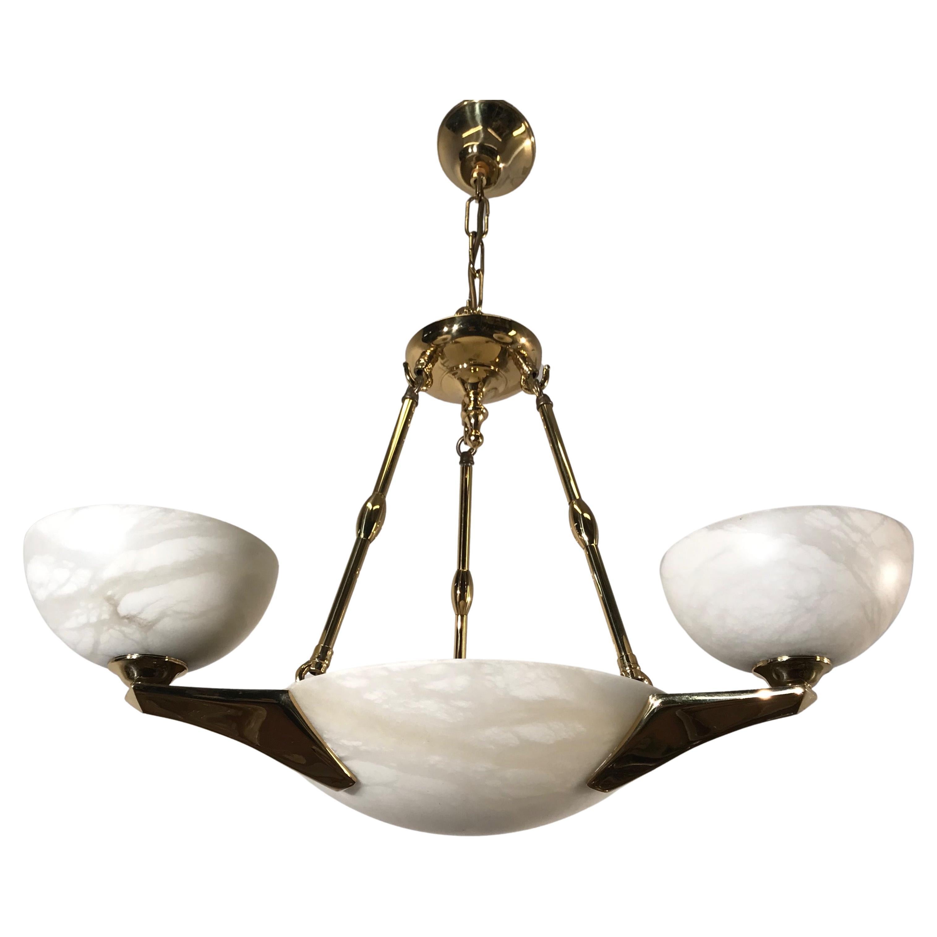 Excellent condition, Arts and Crafts style chandelier.

If you like pendants / chandeliers in the Arts and Crafts style and you prefer to have them looking like new, then this 1970s alabaster shades and bronze arms light fixture could be perfect for