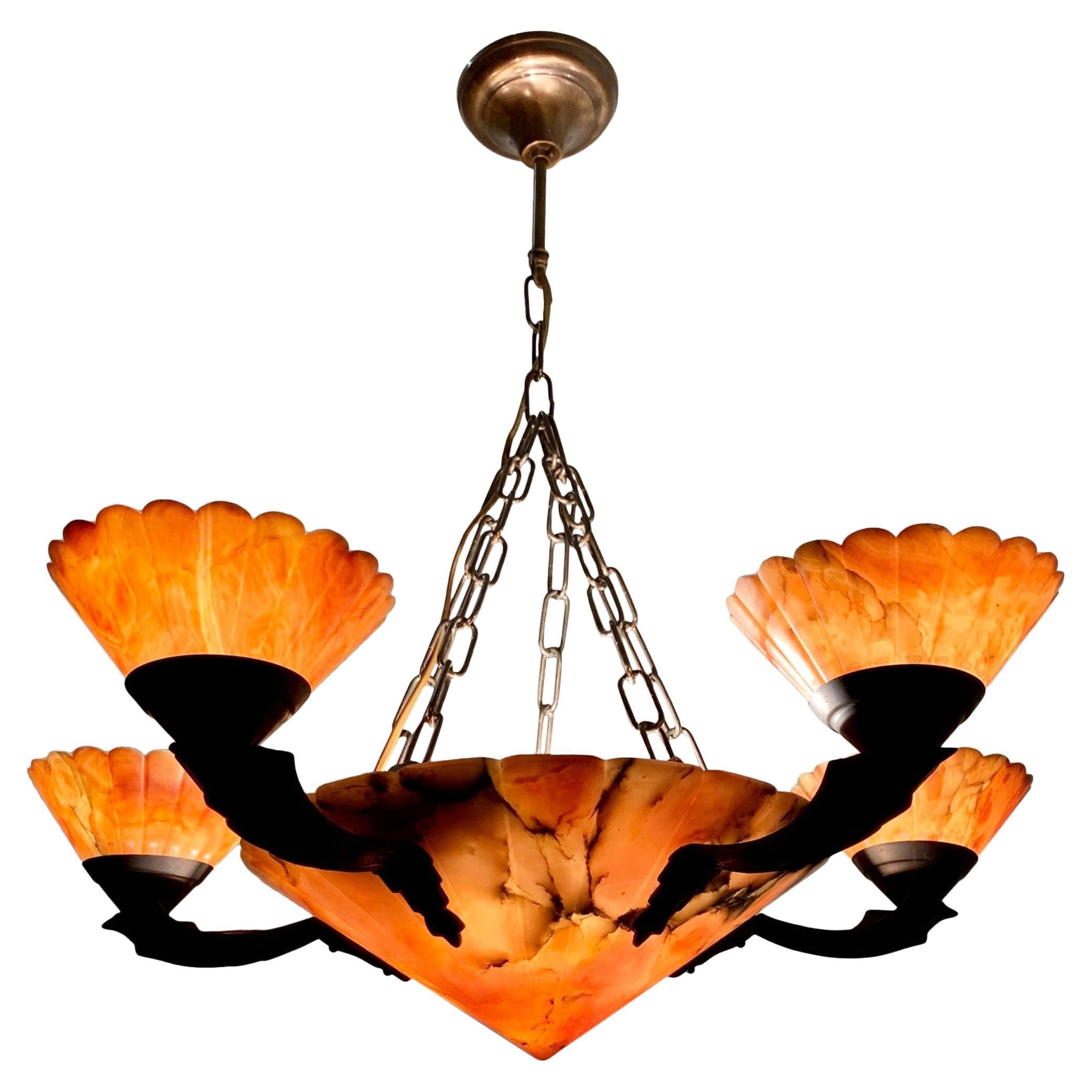 Highly stylish Art Deco pendant for a great atmosphere.

If you are looking for the perfect chandelier (both in design and condition) to grace your dining area then this truly stylish Art Deco light fixture could be yours to own and enjoy soon. The