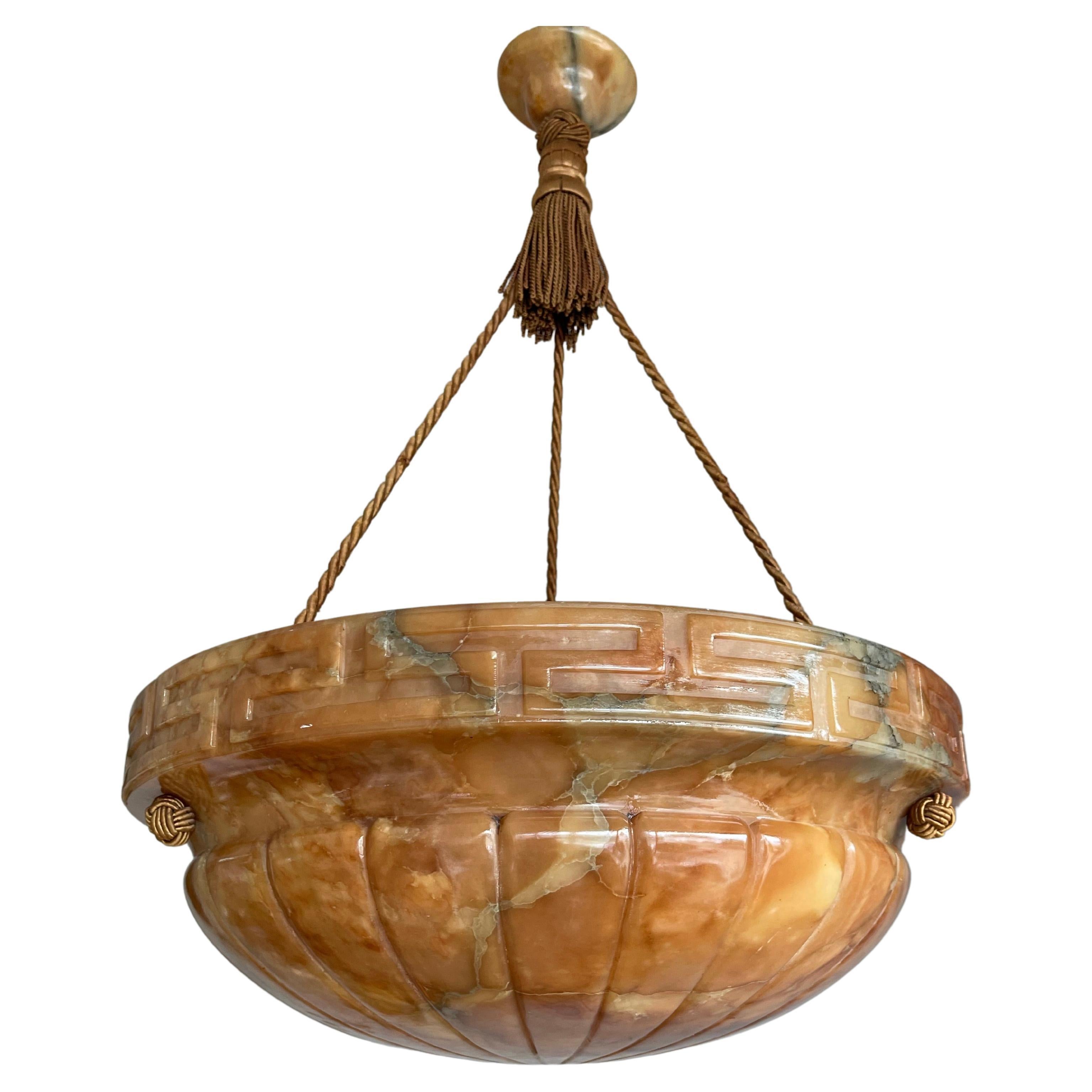 Beautiful design and wonderful light creating, mother nature mineral stone shade plaffonier ceiling light.

This marvelous and top quality carved, early 20th century alabaster pendant is hanging from the original alabaster canopy and perfectly