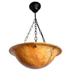 Art Deco Style Alabaster Pendant Light with Amber Glow and Dramatic Natural Vein