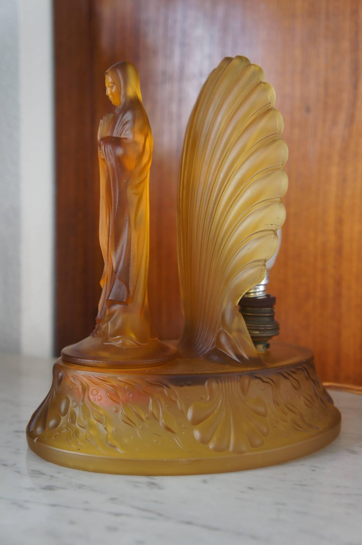 Original and rare Art Deco lamp.

This small but magnificent table lamp is an absolute joy to watch......even if you are not religious or spiritual. Wherever you may place this beauty, it will change the look and feel of the area that it is in.