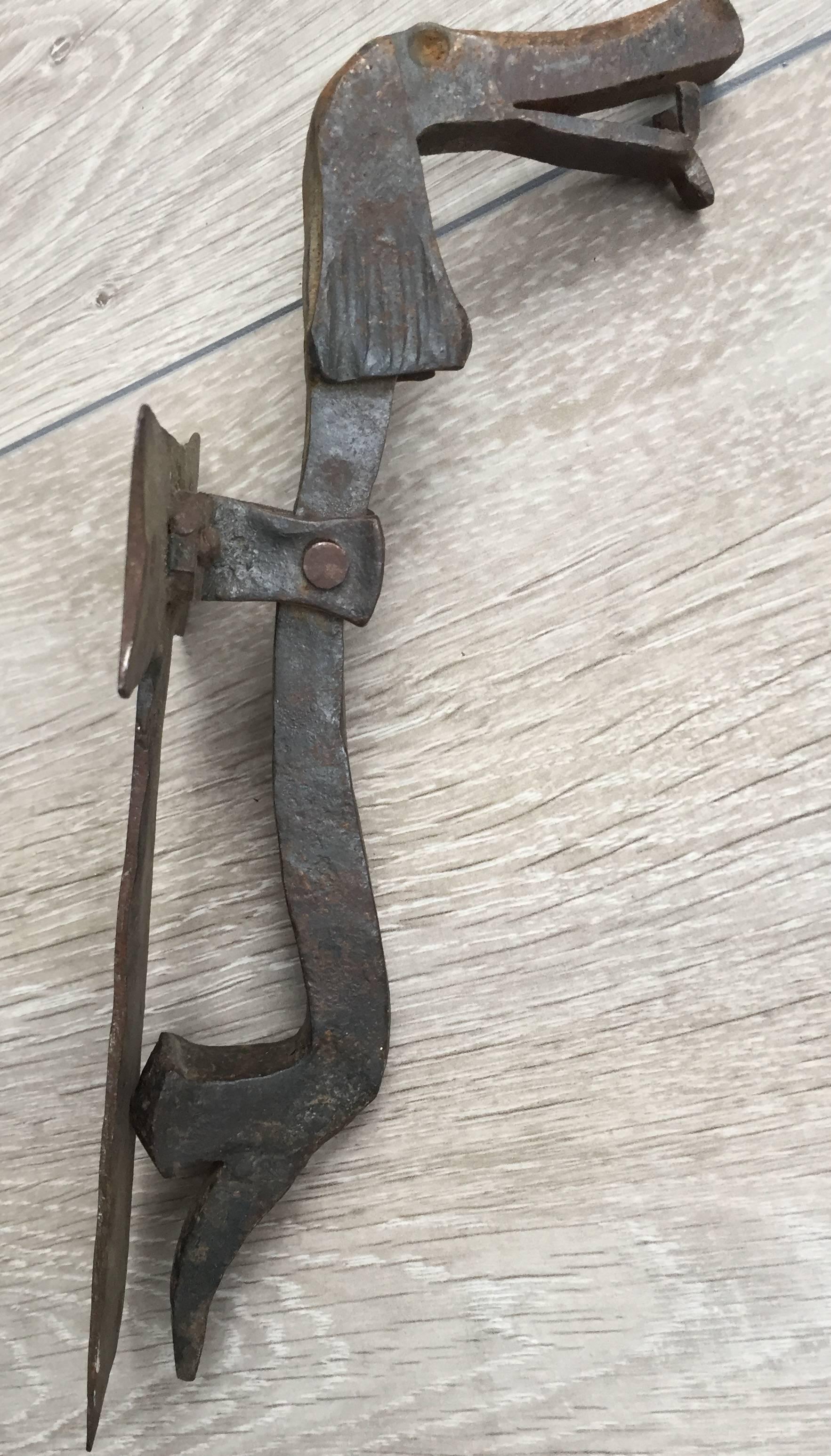 Possibly the most decorative and cool door knocker on 1stdibs.
 
This artistically designed and hand crafted, wrought iron door knocker is a joy to look at. It works perfectly and will look great on any wooden door. It may look ‘simple’ and rough