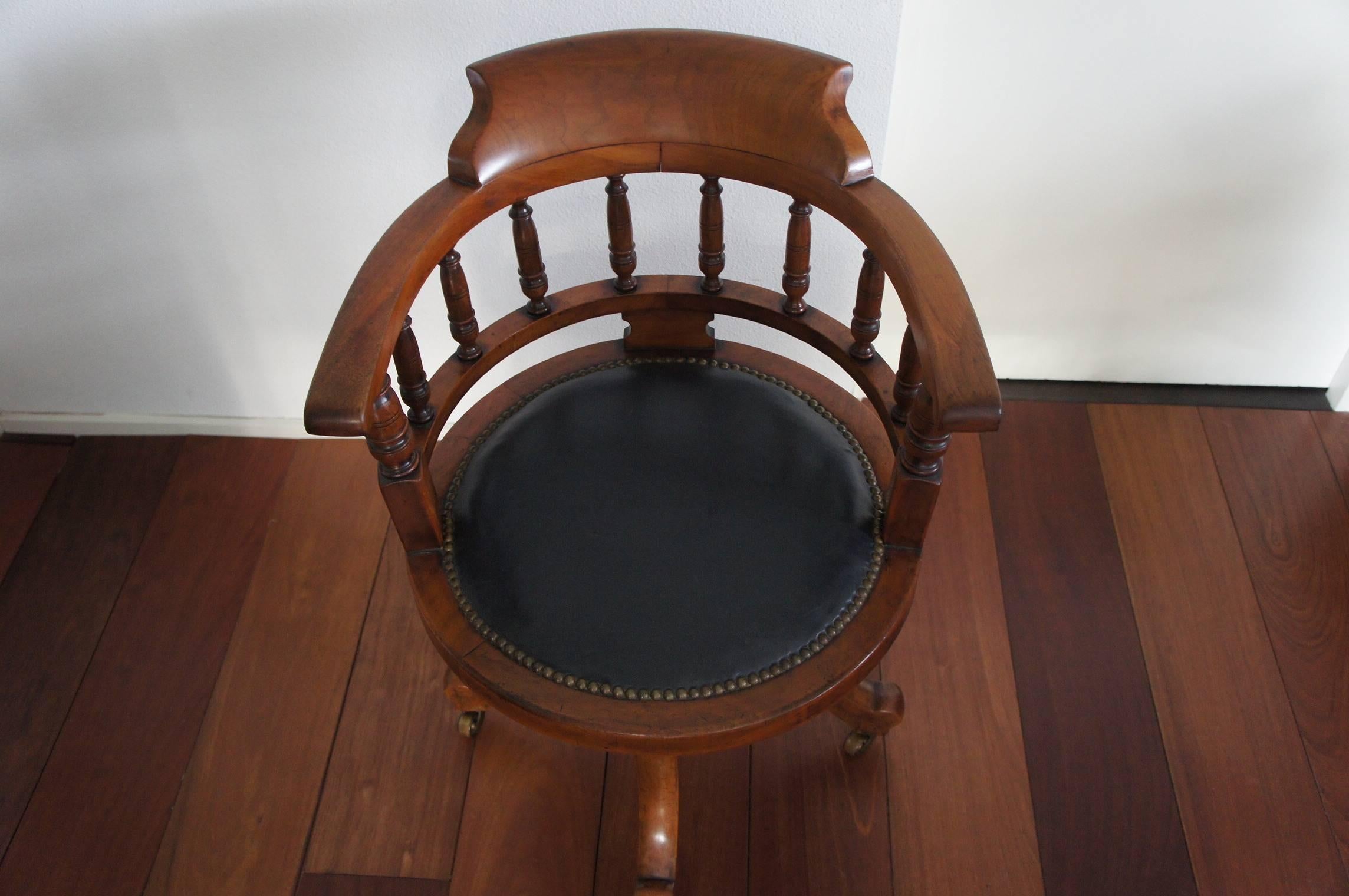 Very stylish and stunning desk chair.

This handmade, rotating armchair is best known as a captain's chair. This chair looks beautiful behind an antique desk but also standing by itself (what I call a 'furniture stillife') it will create a great