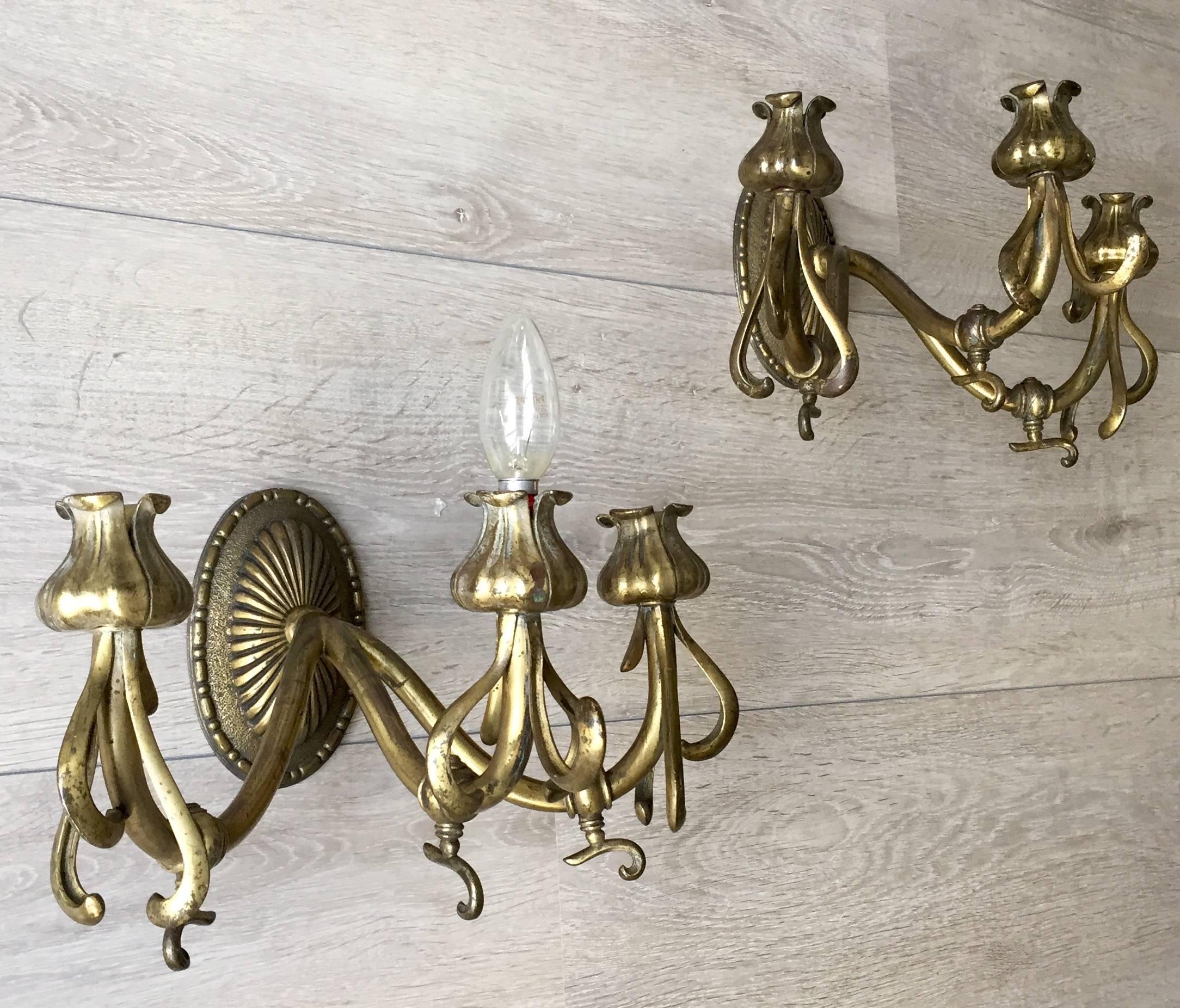 Beautiful Art Nouveau wall sconces from the early 1900s.

This rare and elegant pair of Art Nouveau sconces could also be from the 1890's, because they come with the original gas fittings. The design radiates pure elegance and the details show they
