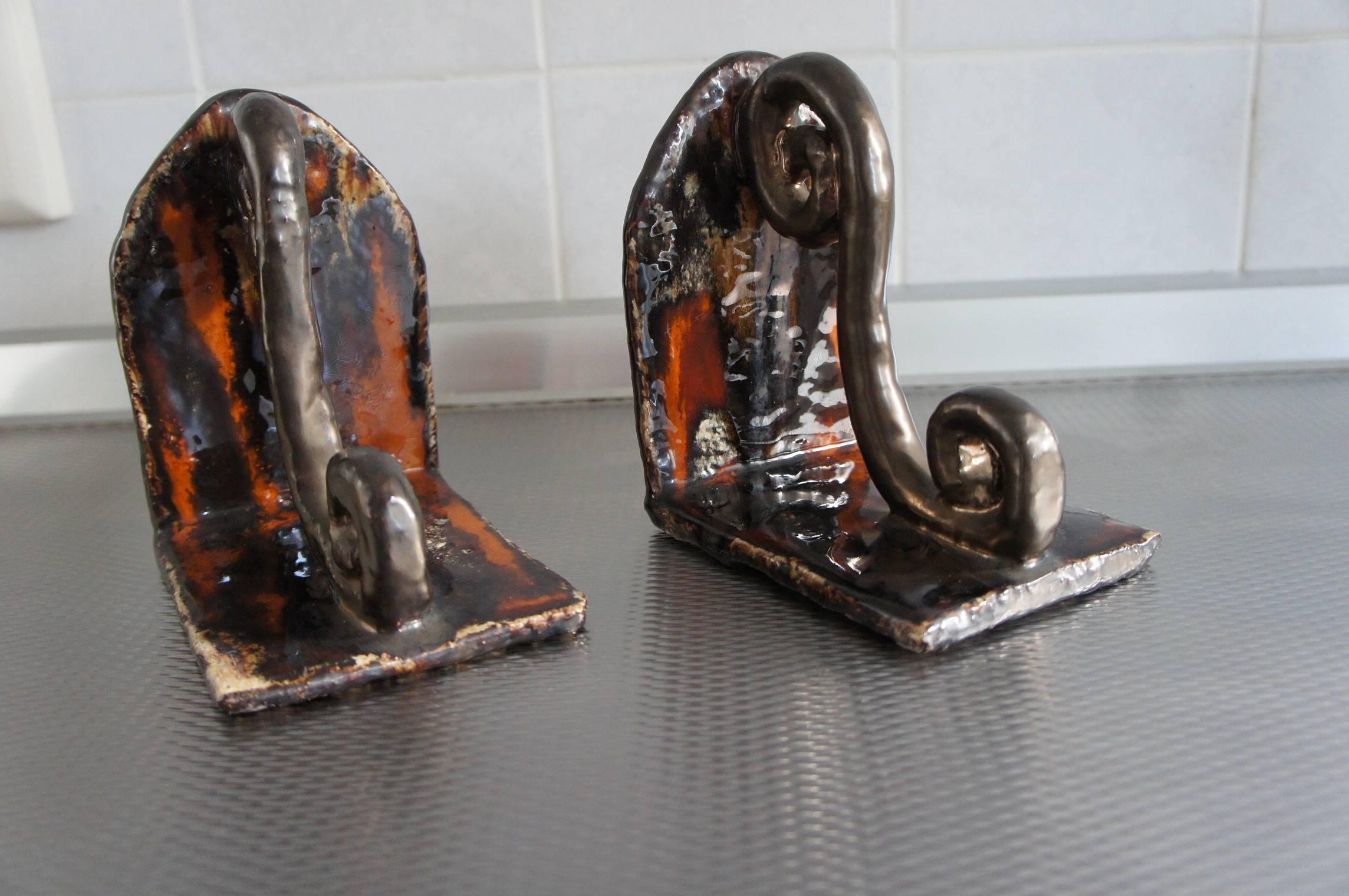 Wonderful pair of beautifully shaped and glazed bookends.

These rare vintage glazed earthenware bookends from Belgium or Germany are in mint condition. These 1960s bookends make great display pieces on a shelve, desk or sidetable. It's amazing how