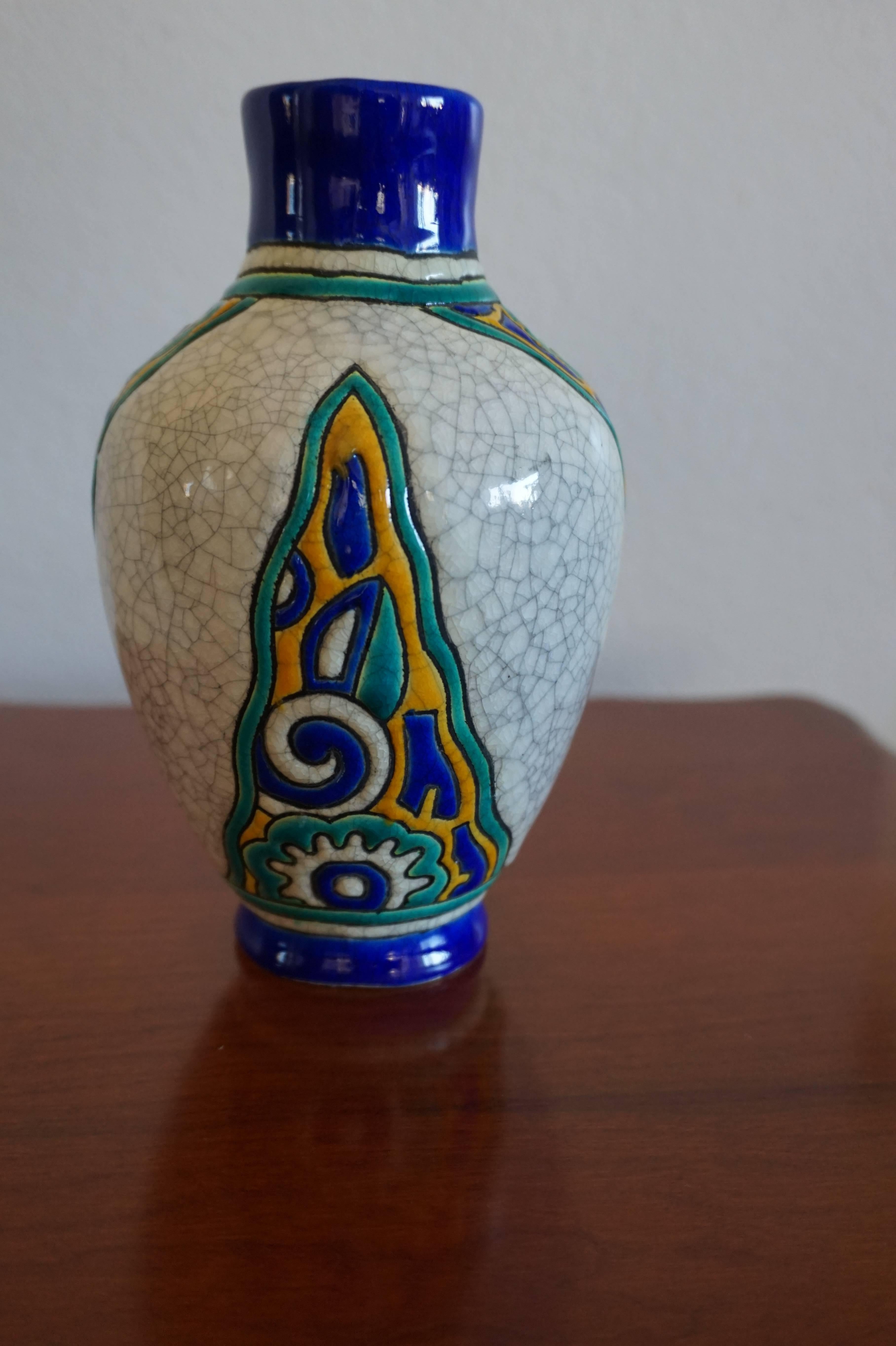 Rare and vibrant little Art Deco vase.

This 1930s vase comes with stunning and vibrant motifs of stylized flowers. It is relatively small in size, but it is a rare and impressive collector's item. There are no chips, cracks or restaurations and it
