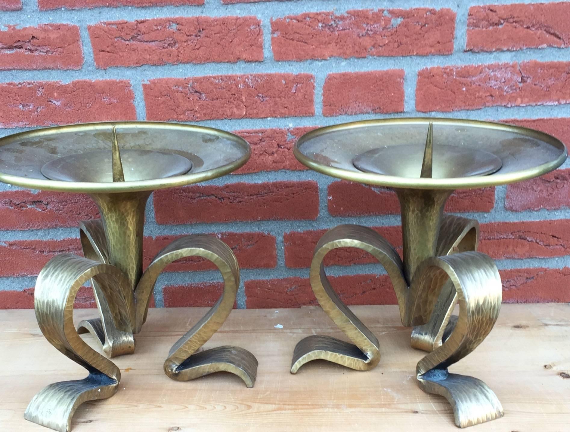 Large and heavy pair of altar candle sticks.

These handcrafted and heavy candleholders are made around 1930 by H. v/d Heijden. With beautiful scrolling feet they are aesthetically designed and a joy to look at. Especially in the evening with the