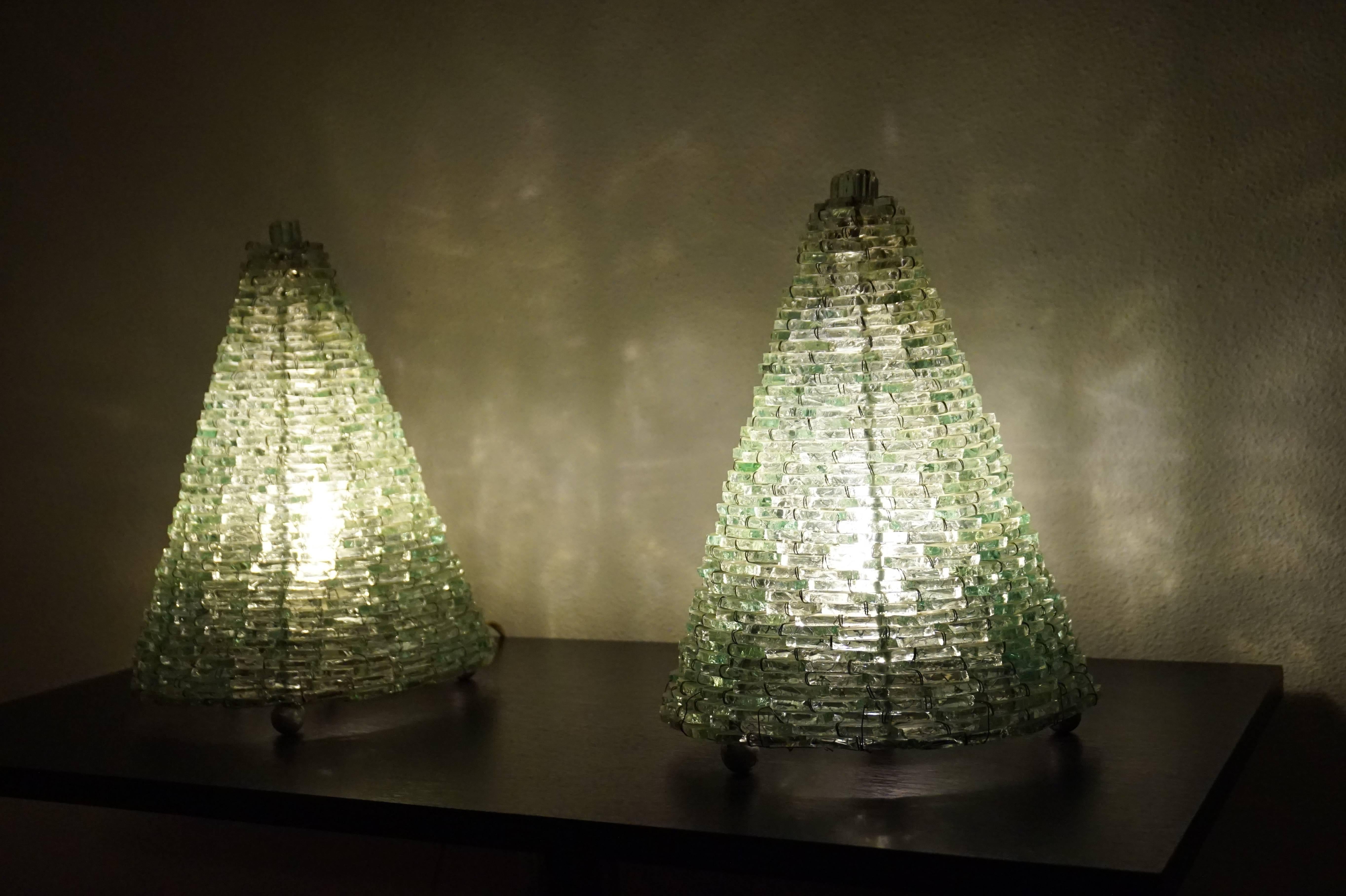 A rare pair of handmade table lamps.

These handmade table lamps of stacked glass are beautiful both on and of. The shape is timeless and in the evening they radiate a warm, spherical light. The glass pieces almost look like stacked pieces of ice.