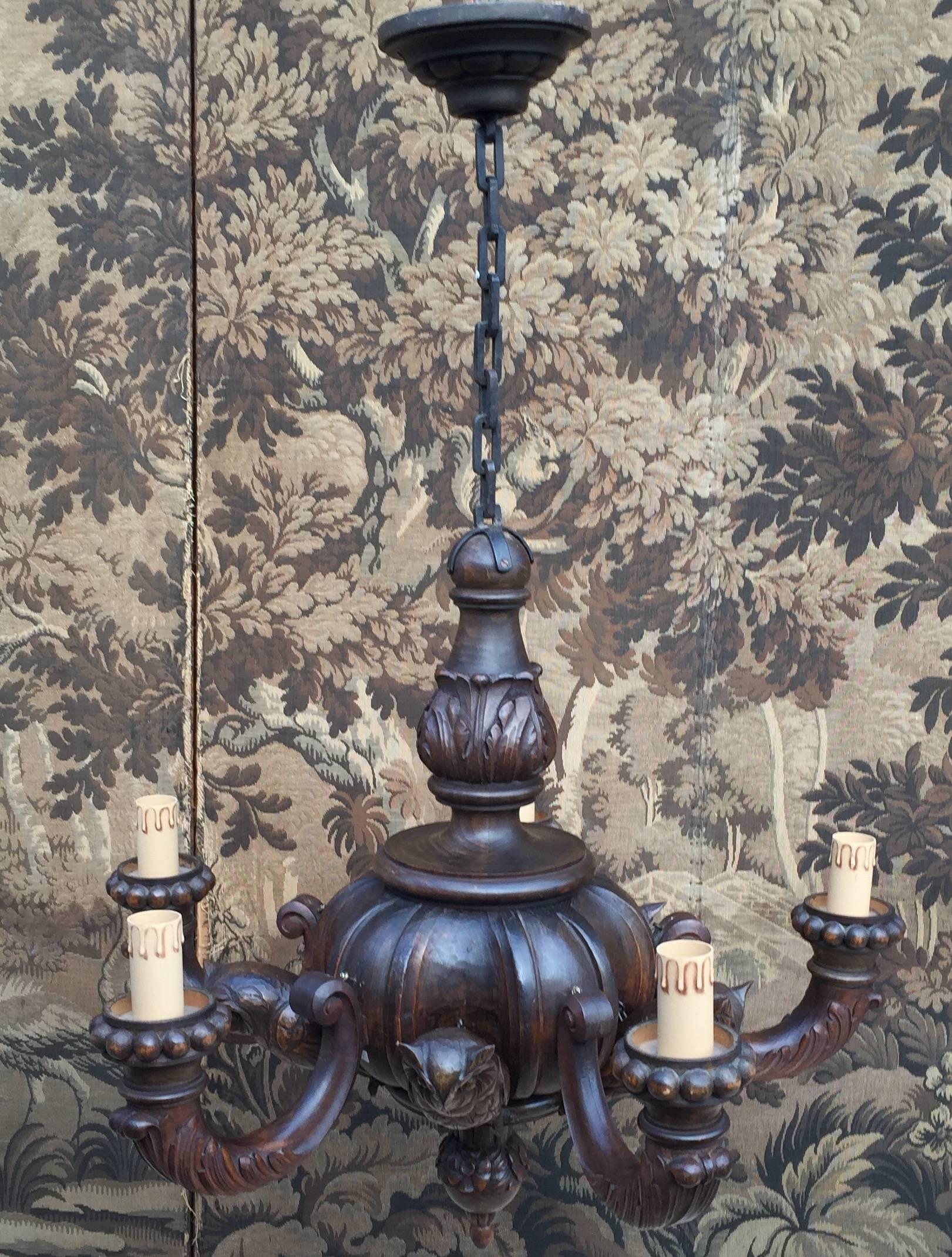Beautiful and rare German chandelier.

We sold many chandeliers through the years, but never did we see one with as much as five carved owls. It is a unique example and it is made and marked by the 'Kunstgewerbliches Atelier' of Josef Hampp in