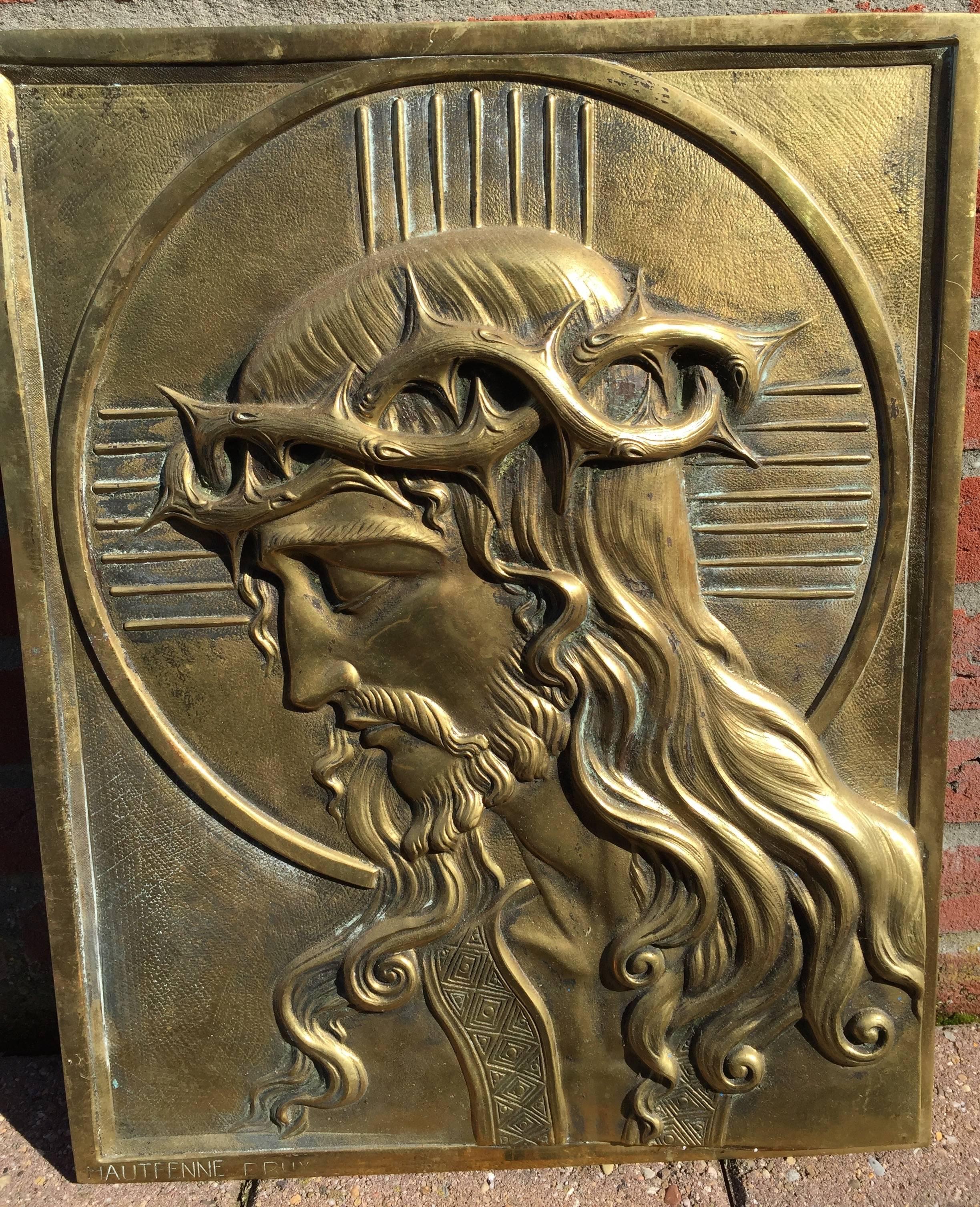 Rare and sizeable Art Nouveau religious plaque.

This heavy and high quality bronze wall plaque depicts Jesus Christ with a stylized crown of thorns. We feel that this religious artifact dates from the transitional period between the Art Deco and