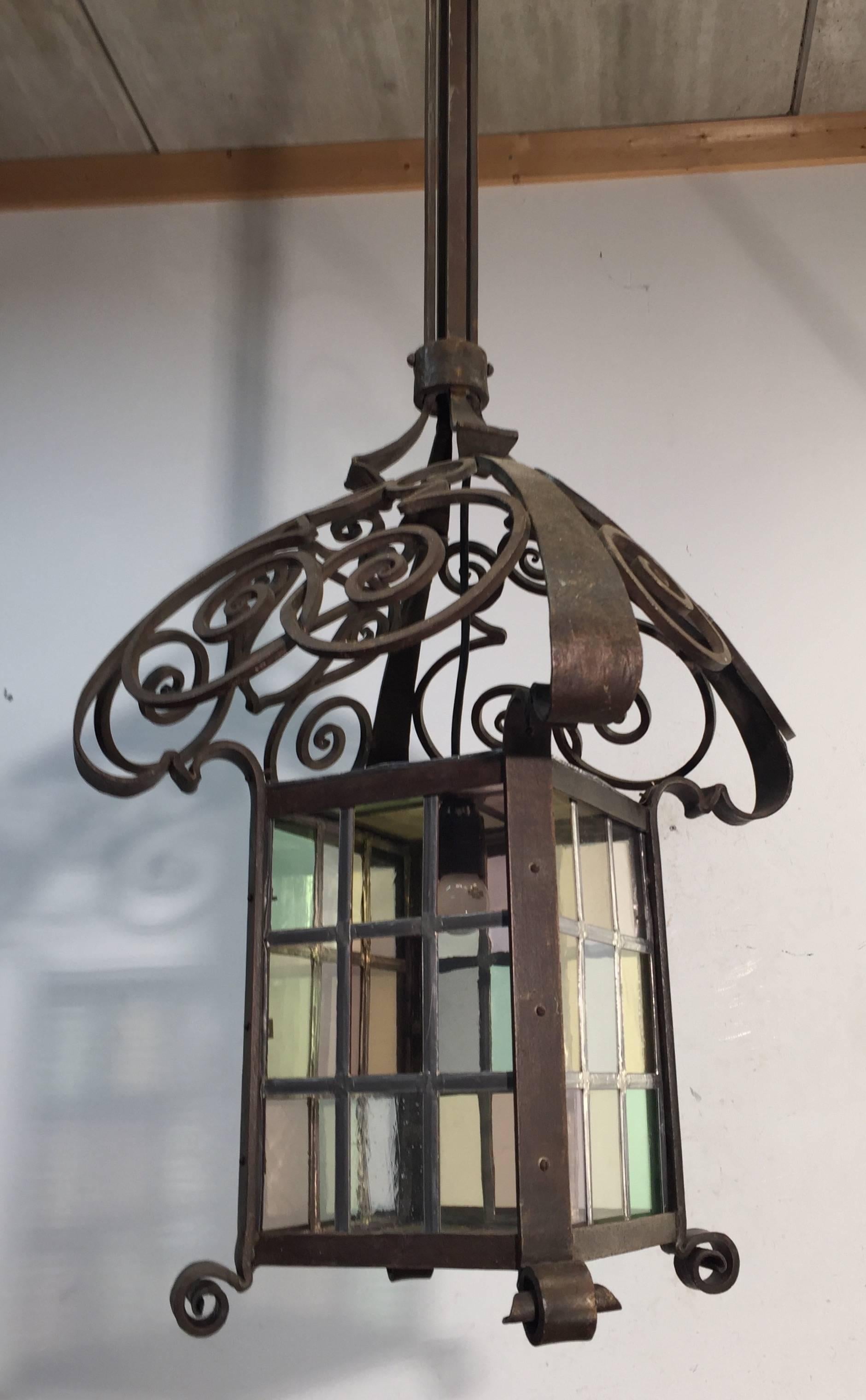 French Early 1900 Large Arts & Crafts Wrought Iron Lantern / Pendant with Stained Glass For Sale
