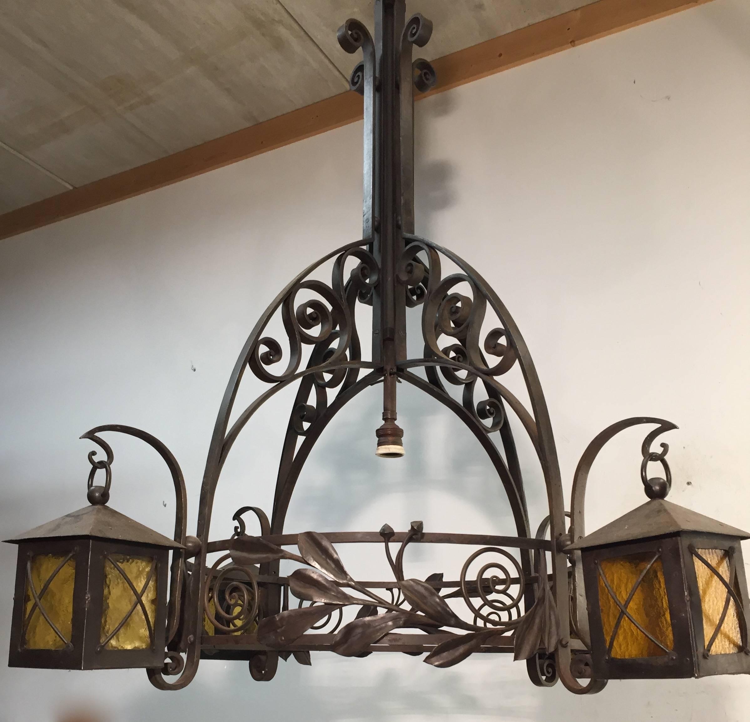 Hand forged and scrolled Arts and Crafts chandelier.

This amazing, five-light pendant light is in beautiful condition and it will be rewired for safe usage wherever you are. The design and the quality is an absolute joy to watch and it came to no
