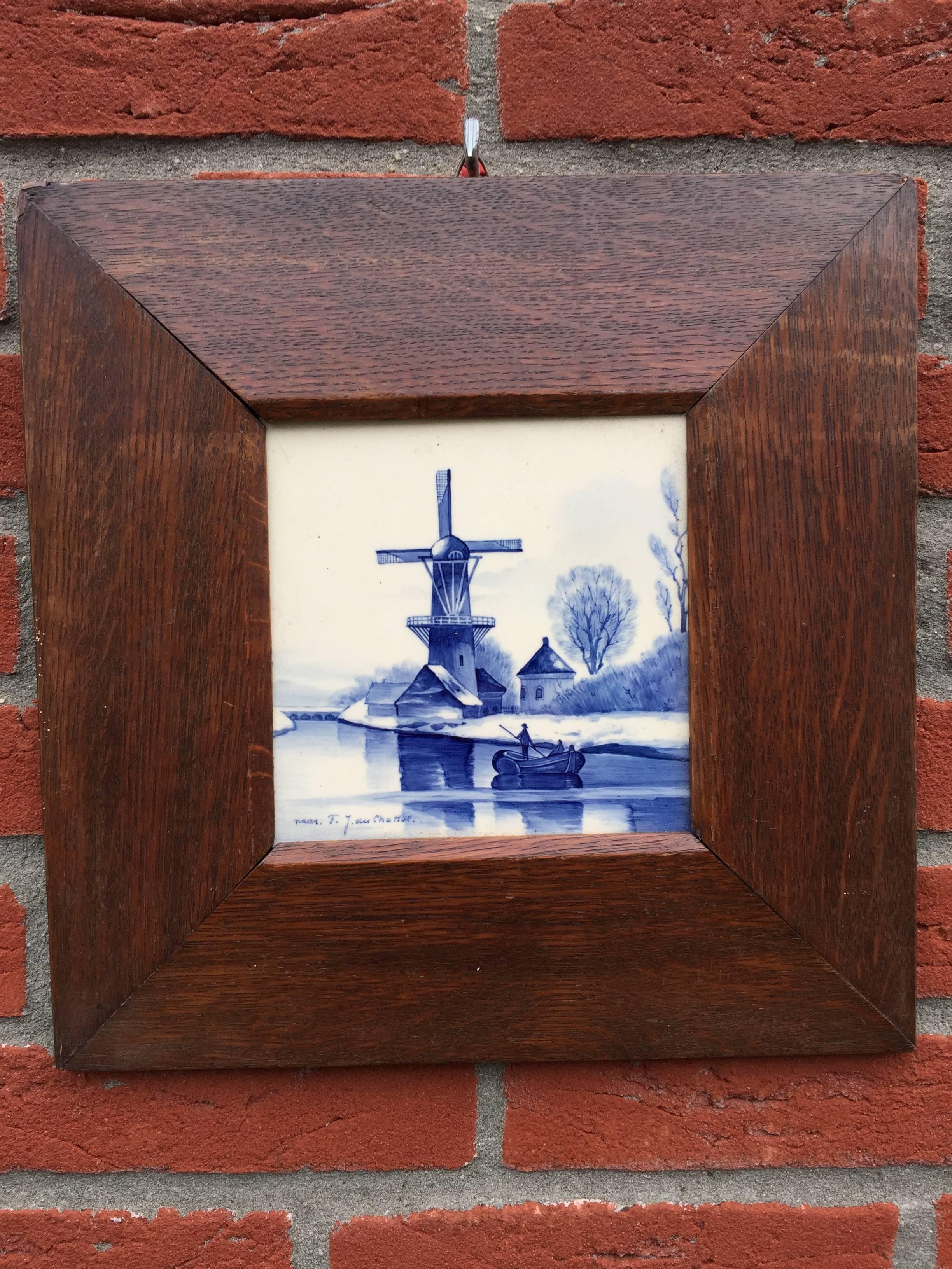 Antique pair of Delft blue tiles mounted in oak picture frames.

These wonderfully hand-painted tiles with beautiful shades of blue are after two famous and early Dutch paintings. The landscape with windmill is painted after F.J. van Rossum du