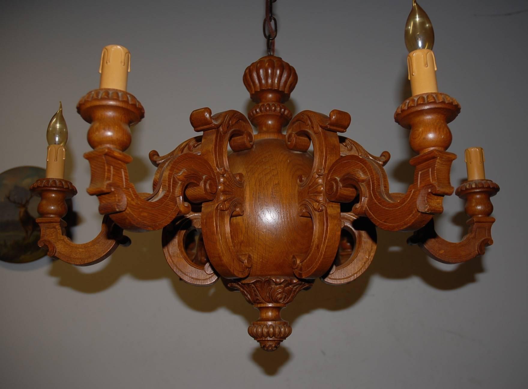 Good size and modernist shape six-light chandelier from circa 1920.. 

If you are looking for a sizeable and stylist wooden chandelier with a warm look and feel to create just the right atmosphere in your dining room then this could be the one for