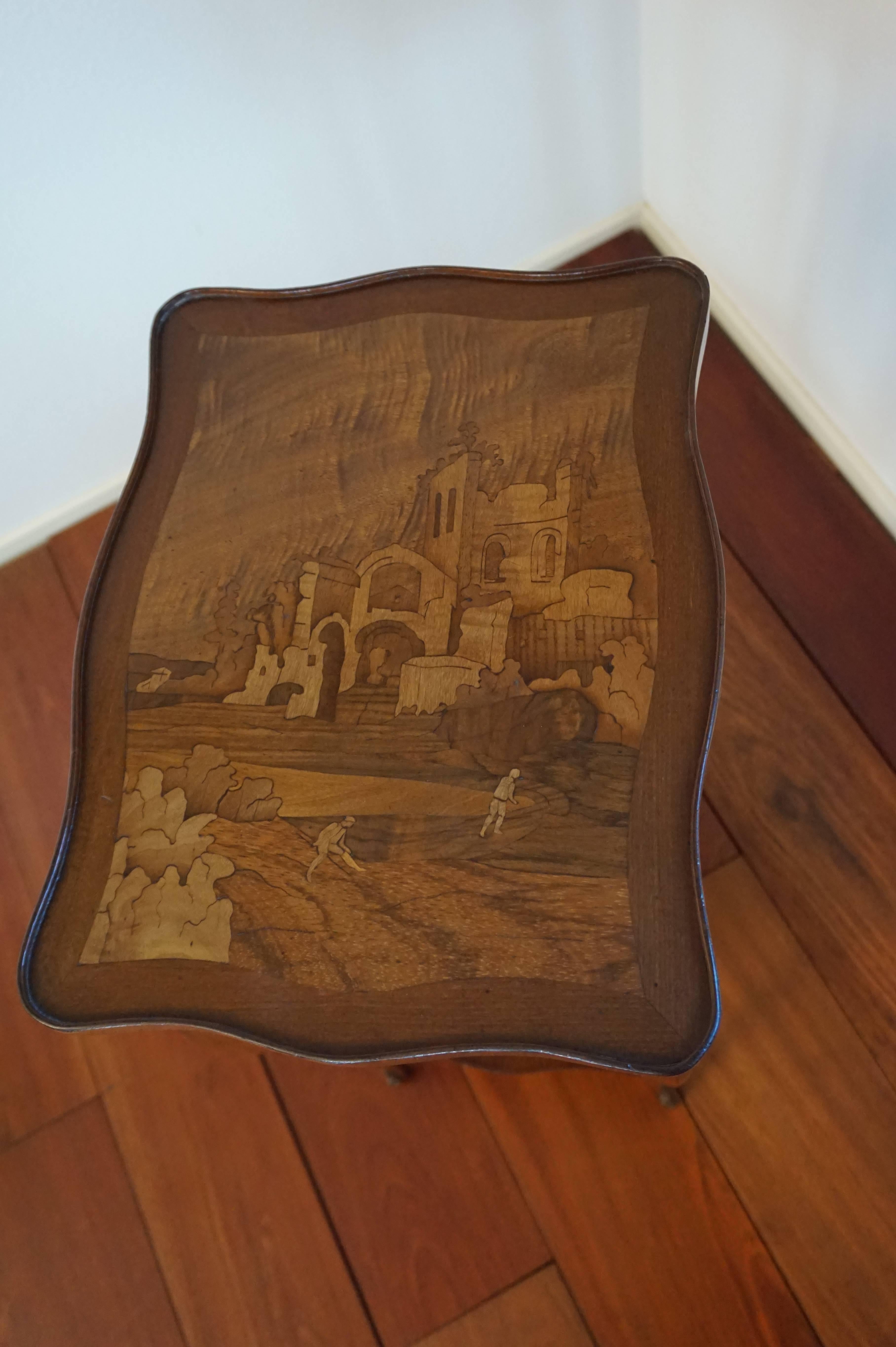 Exciting and rare table with amazing marquetry inlay.

Another unique piece of furniture for those who have an eye for quality, style and elegance. This stunning little end table is a joy to use and look at and it is in excellent condition. It is as