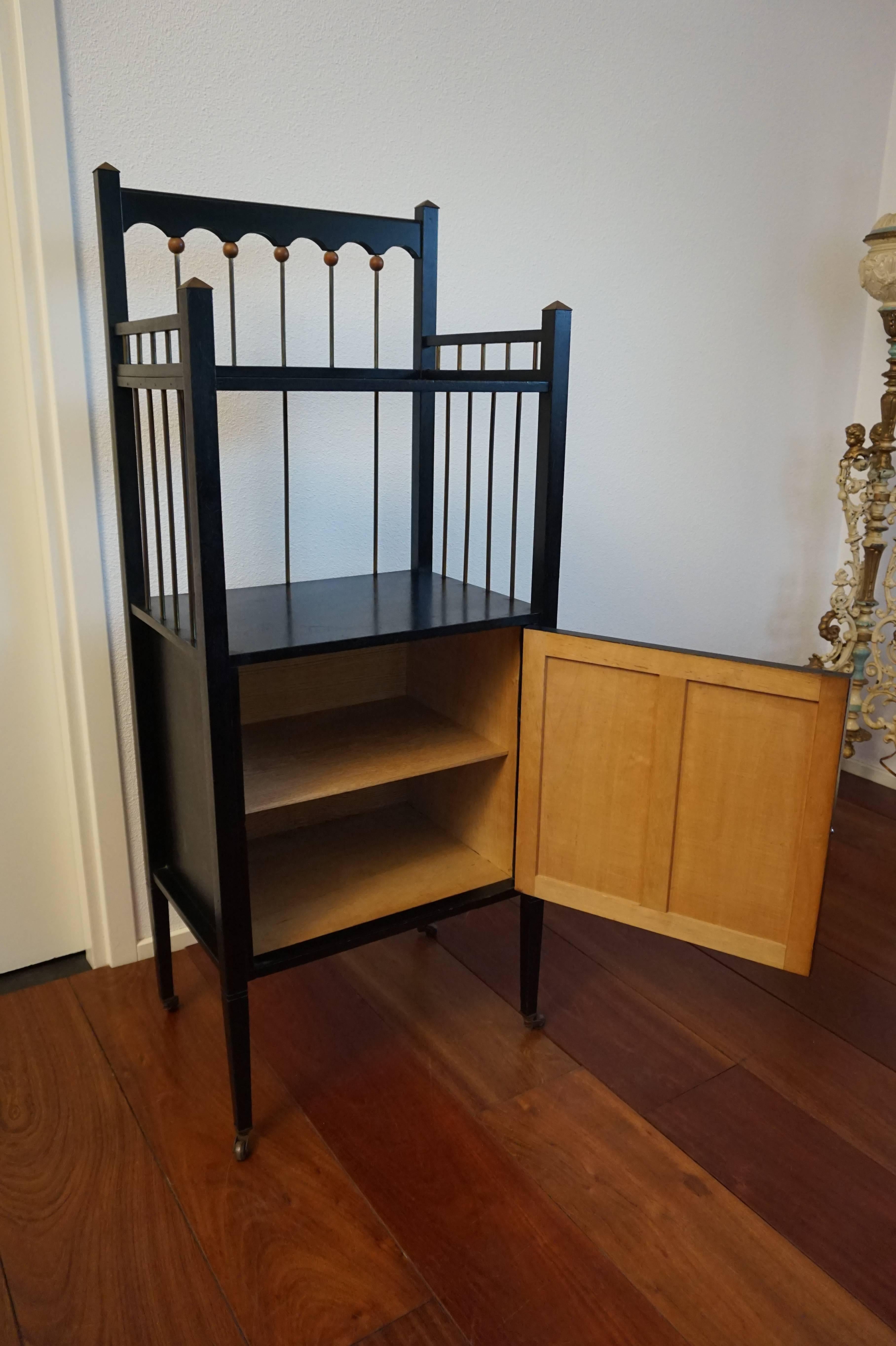 Practical and very stylish modernist table with cabinet.

We always feel blessed when we are able to acquire yet another rare and stylish design that is over a hundred years old. Imagine this angular modernist, ebonized Stand coming onto the market