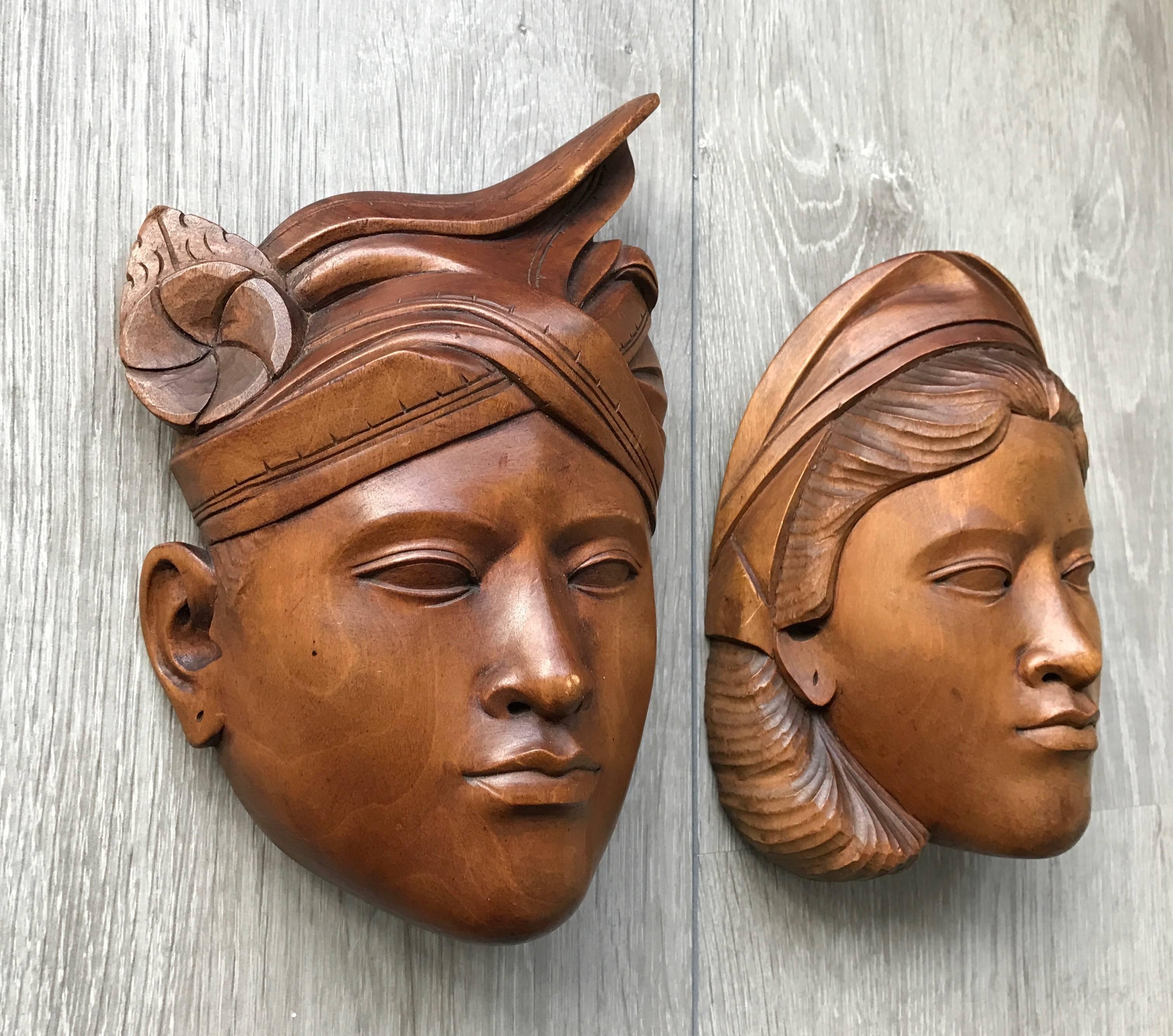 Decorative and handcrafted, solid wooden wall masks.

These skillfully carved masks date from the 1950s and they were most likely for and given to newlyweds. These well carved face masks can be compared with wedding pictures only these 'wooden