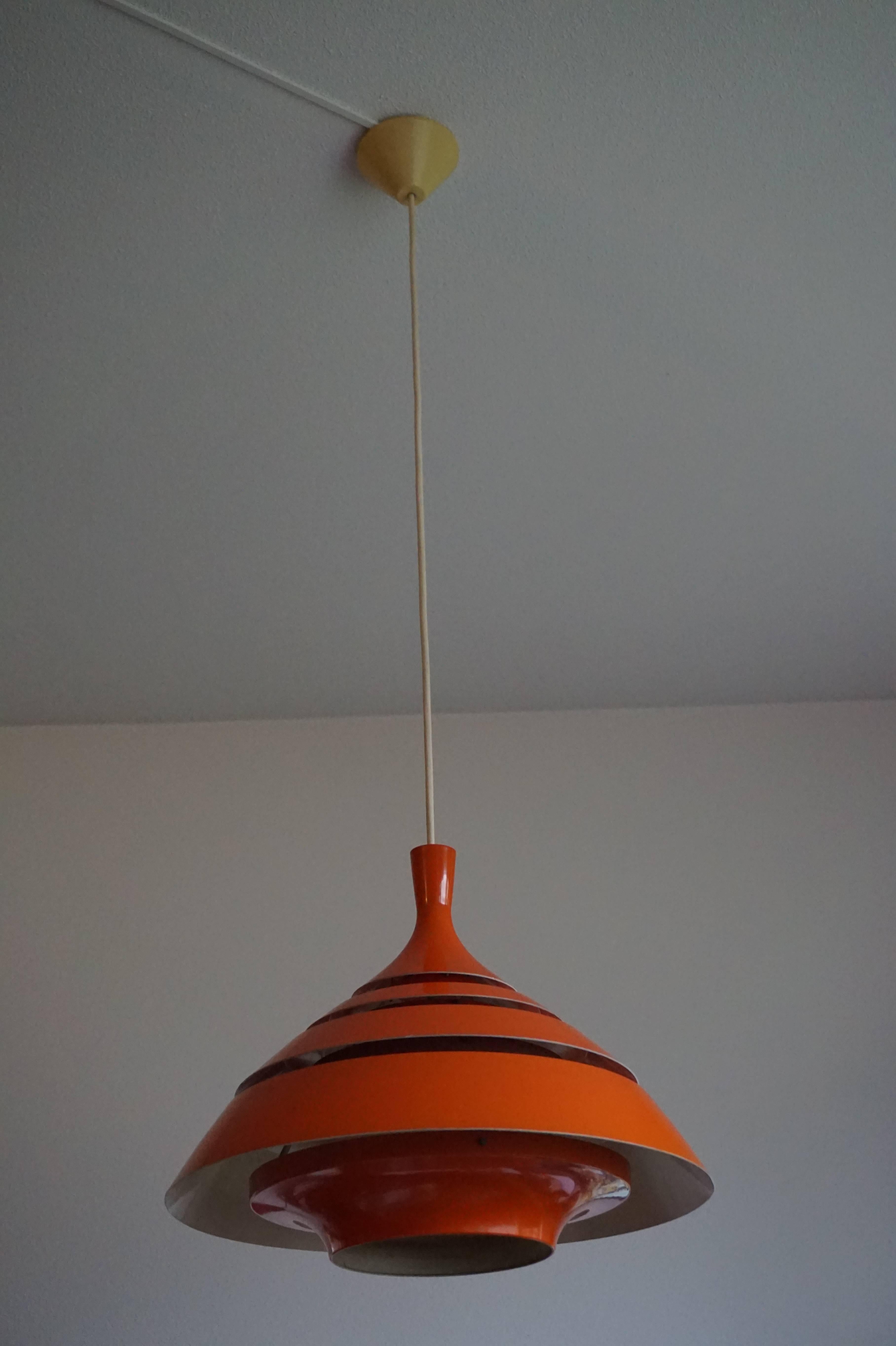 Vintage design metal pendant by Hans-Agne Jakobsson.

This stylish orange pendant will look great in your kitchen, hallway, bedroom or Mid-Century modern office. If rare and stylish is what you are after than this metal (we think aluminium) orange