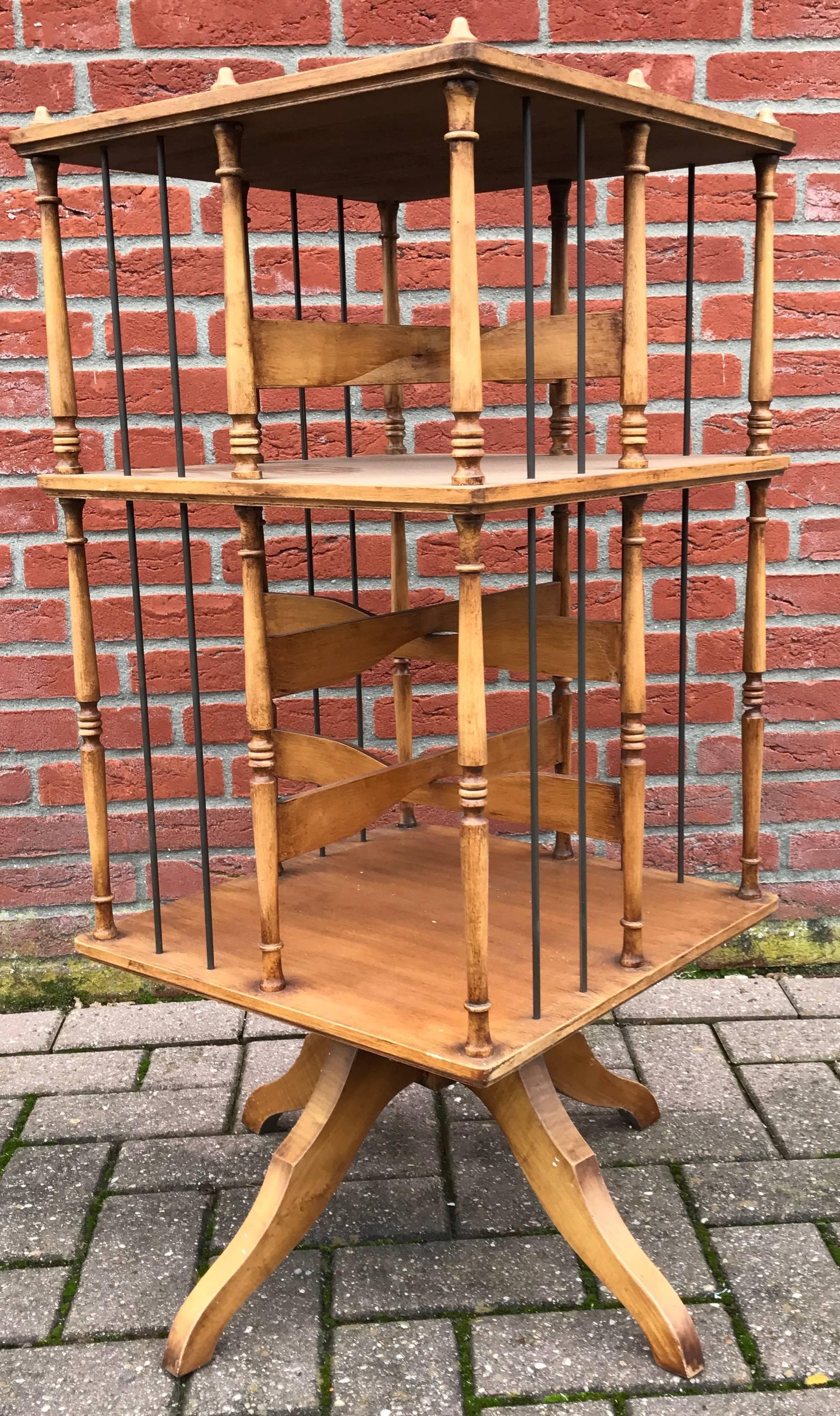 Vintage two-tier carousel bookcase.

This lovely book stand is in excellent condition with two levels of bookshelves that are ready to hold your books and/or picture frames. This is an ideal decorator's piece for a library or study. Because of it's