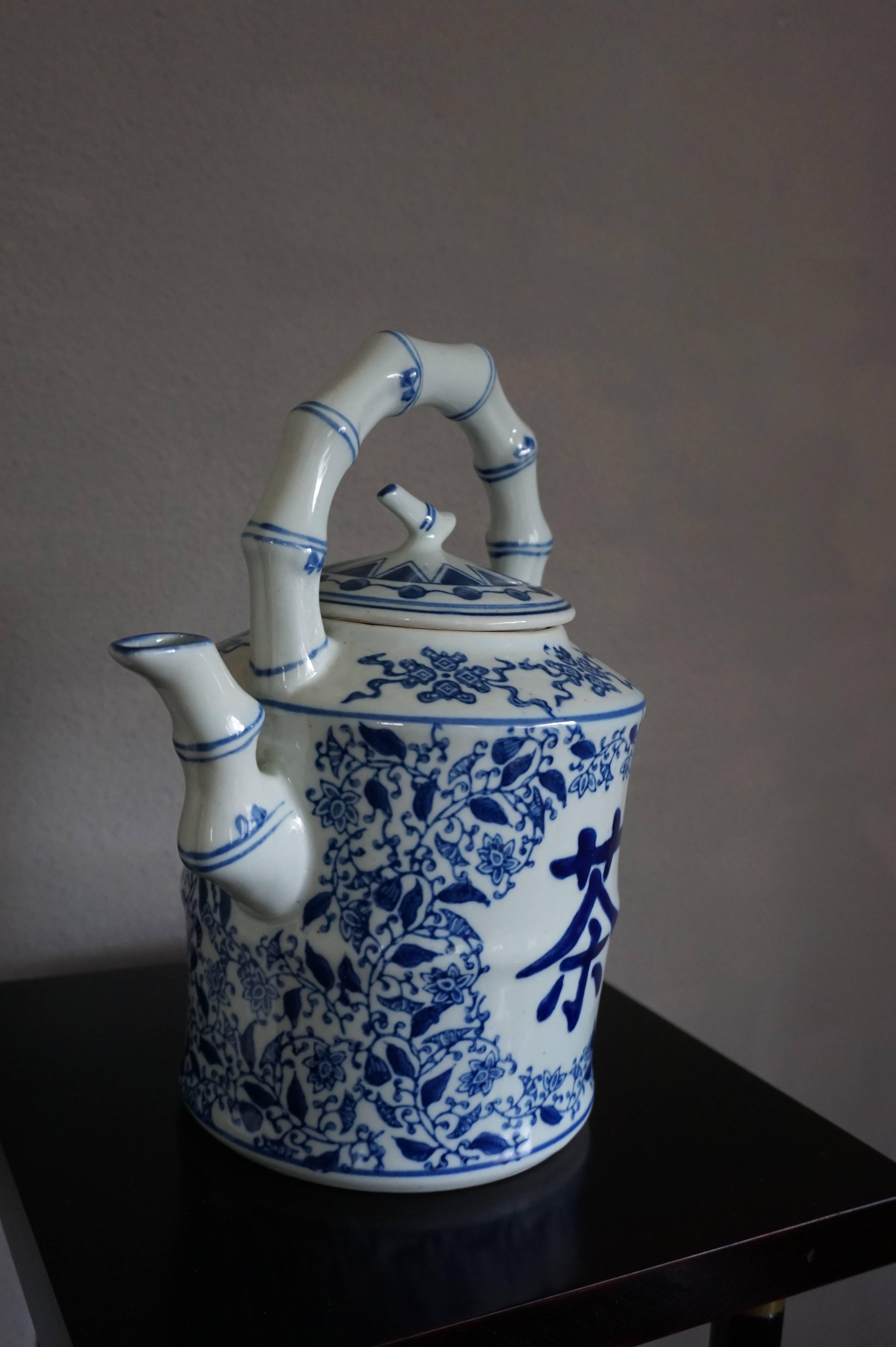 Good size and stylish Chinese teapot. 

This blue and white ceramic teapot embodies much of the ancient tradition of tea drinking in China. It may have never been used, because it is as clean as a whistle. The bamboo pattern and the glazed surface