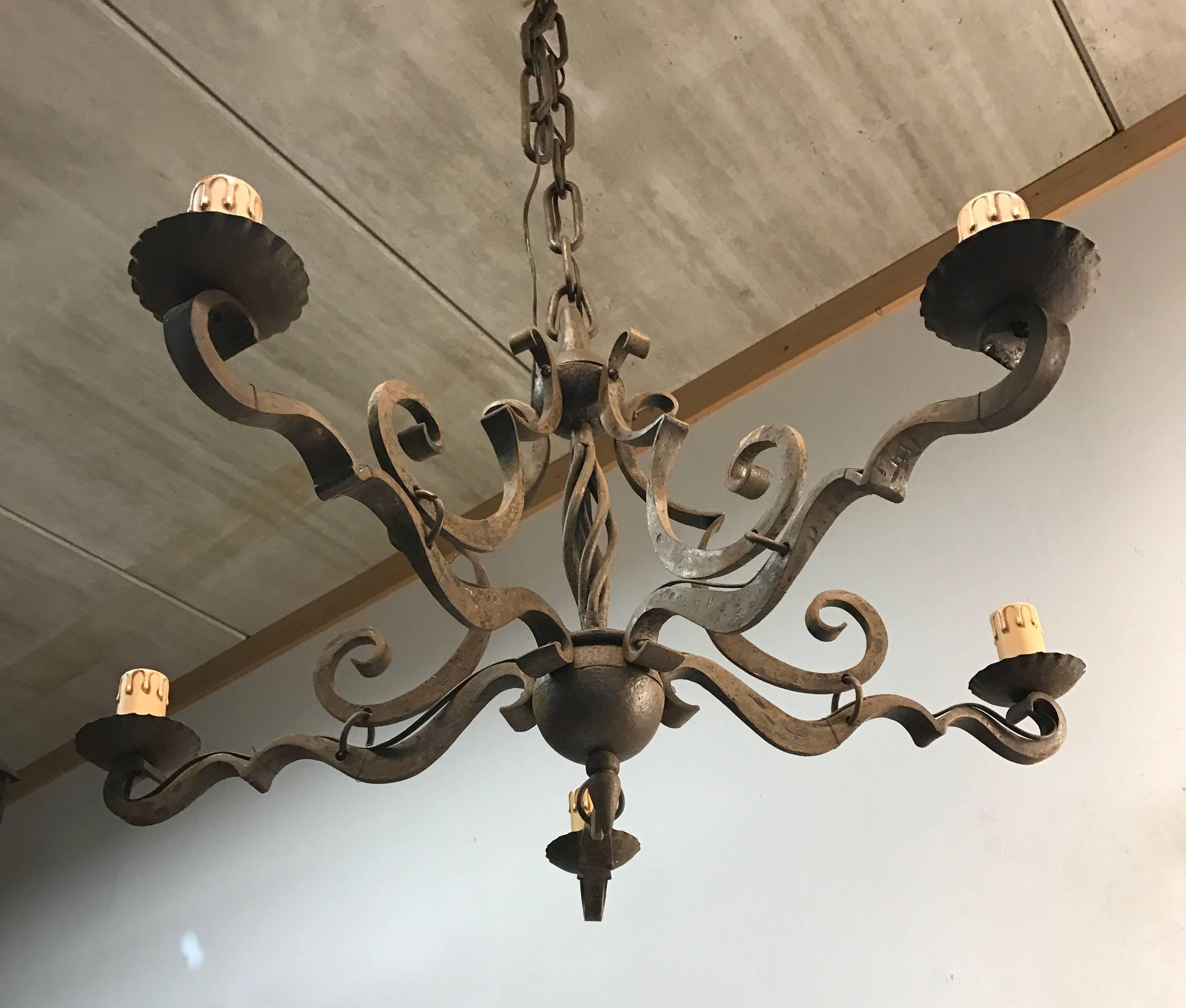 Great quality, handcrafted wrought iron work of lighting art.

Only the best black smiths left in the world today understand the degree of difficulty when it comes to reproducing the thick arms of this chandelier in exactly the same shape and