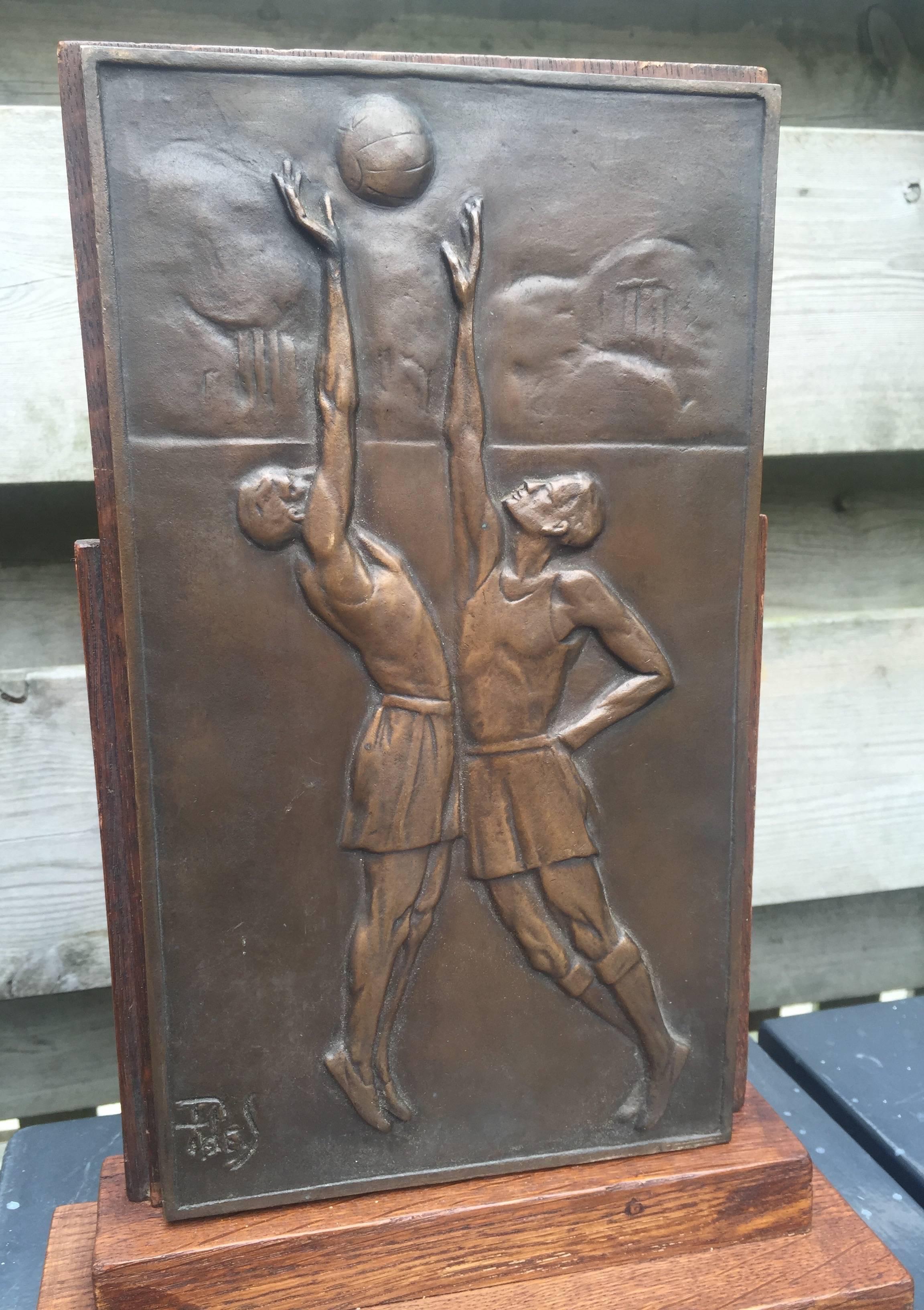 Sports related and rare Art Deco desk piece. 

Sports related Art Deco pieces are few and far between. To find one depicting two man playing the grand sport of Basketball again felt like a blessing. The quality of the relief and details of this