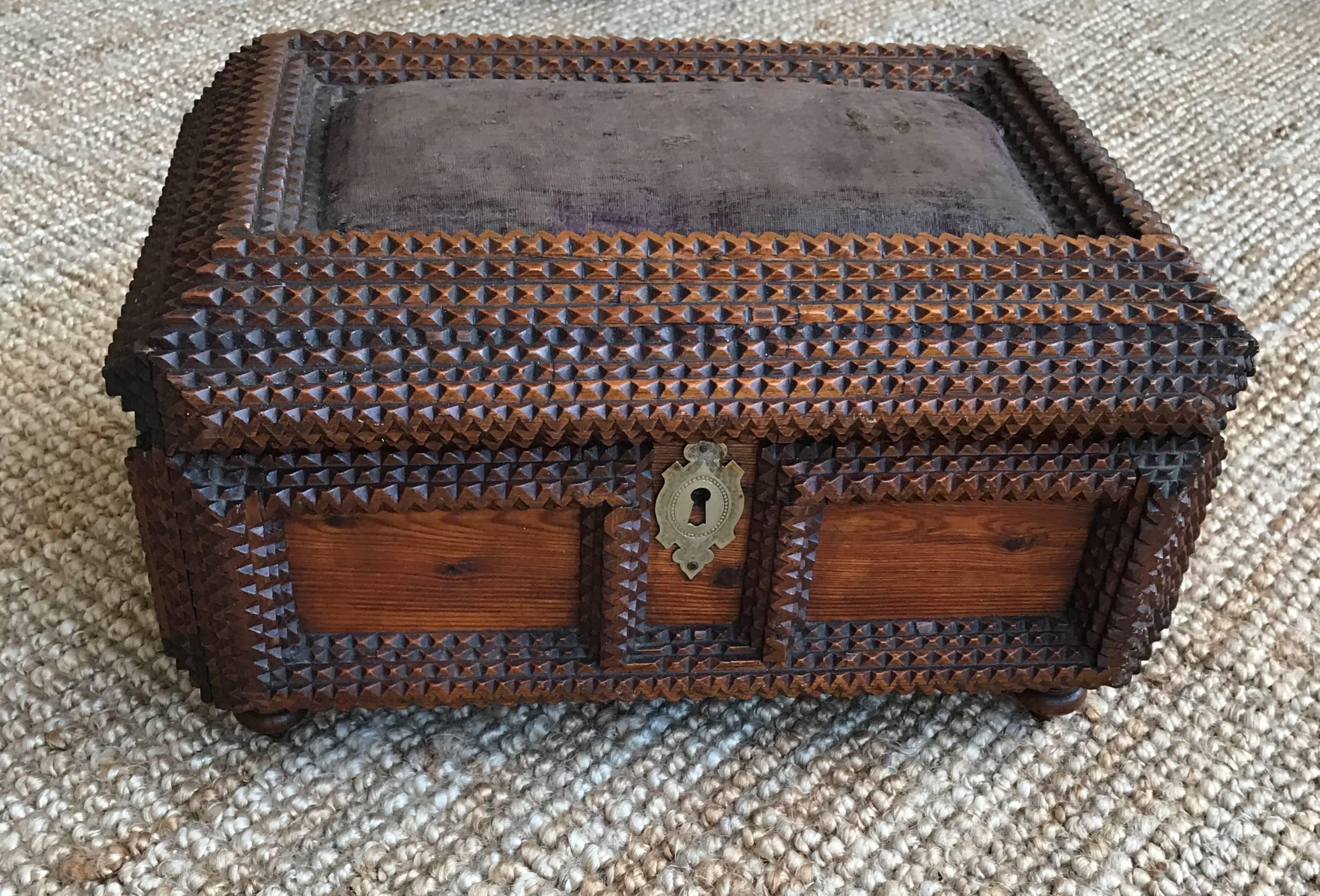Good size, late 19th century folk art box.

This handcrafted tramp art box is covered with geometric designs creating alternating depths on all sides. This beautiful example dates from circa 1880 and can be used for all kinds of purposes. The color