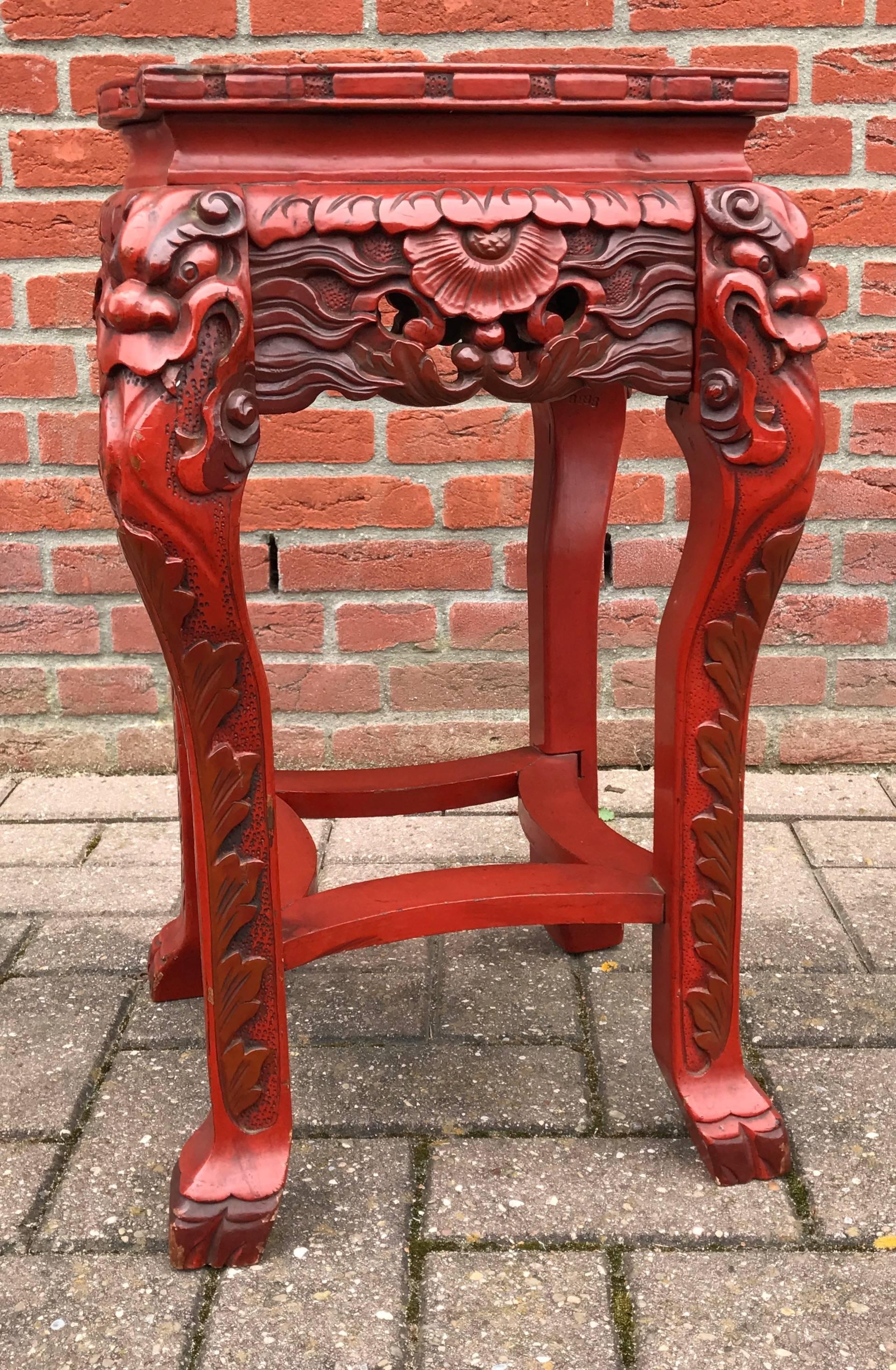 Unique and highly decorative, Japanese table or stand.

This rare and ornate, hand-carved Japanese table is marked at the bottom with a paper makers' label. It reads 'made in Japan' and there also is some sort of monogram (see image 10).

This