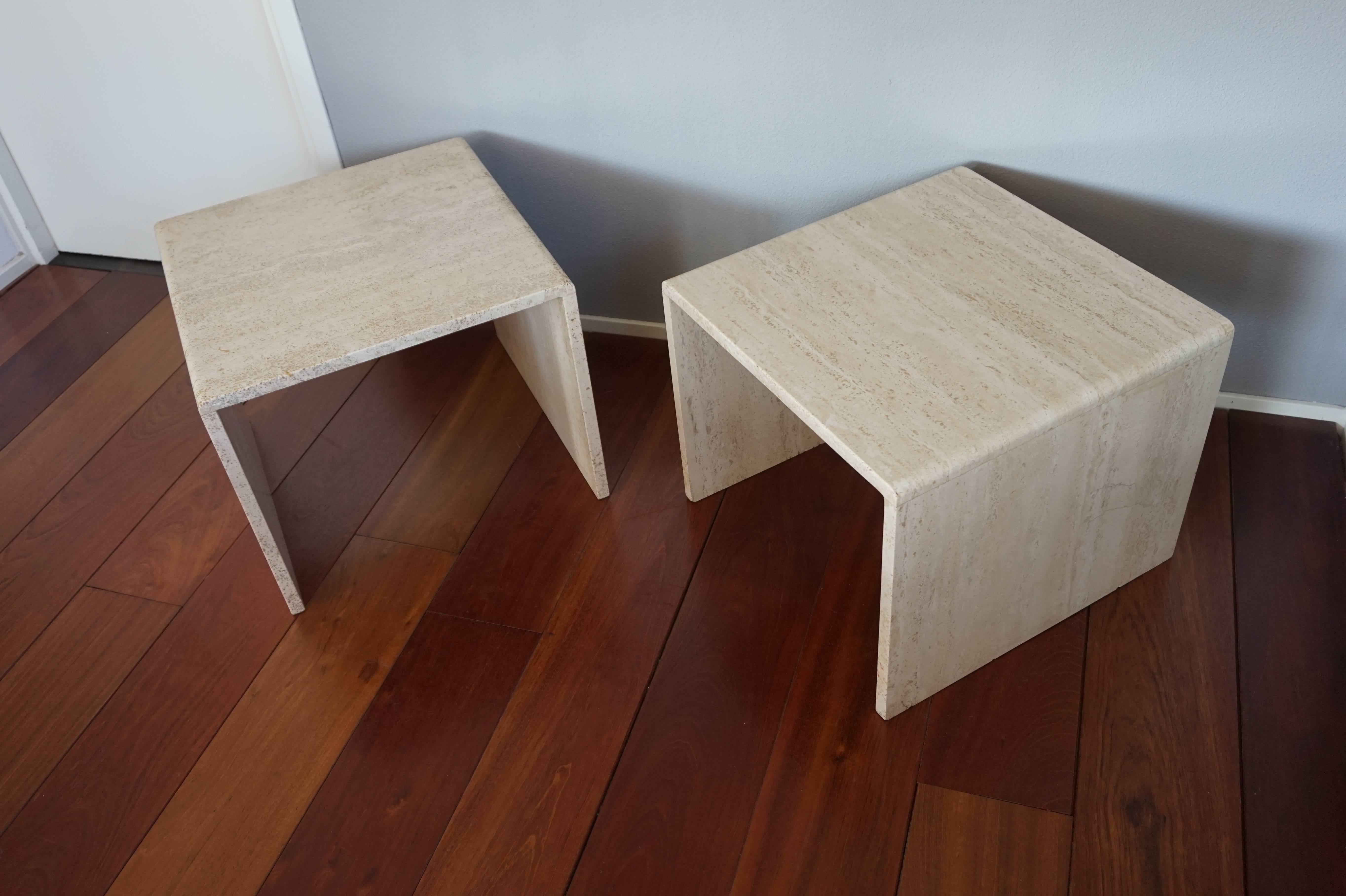 Stylish and functional pair of Italian, multipurpose hardstone tables.

This matching pair of angular travertine tables with rounded sides is in good to excellent condition. Because of their practical size and Minimalist design they can be used in