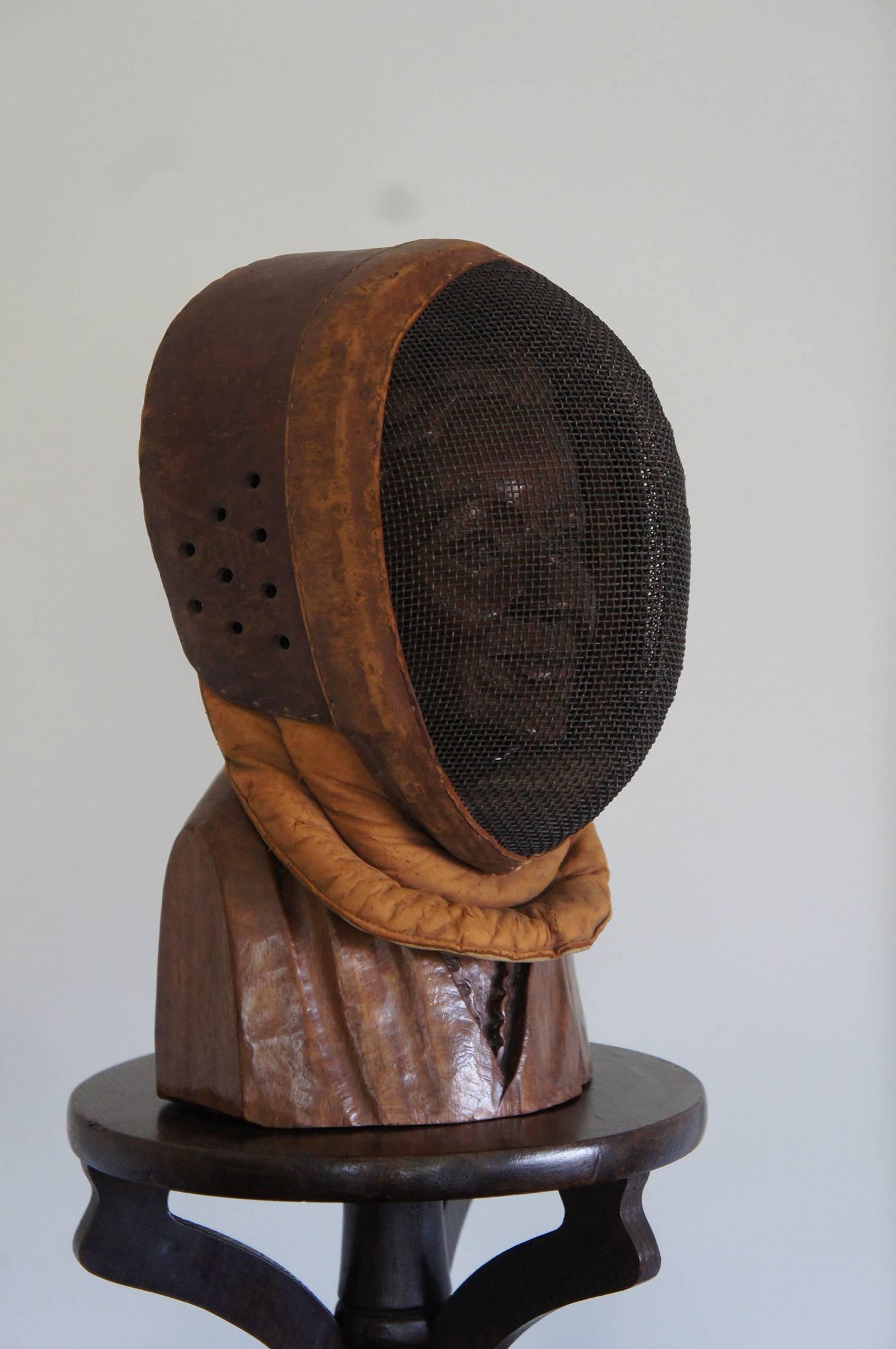 A great decorator's piece at an even better price.

If fencing is your passion then you could not wish for a more beautiful artefact than this 1920's leather fencing mask. And even if you are not a fan of the sport, this also makes a stylish and