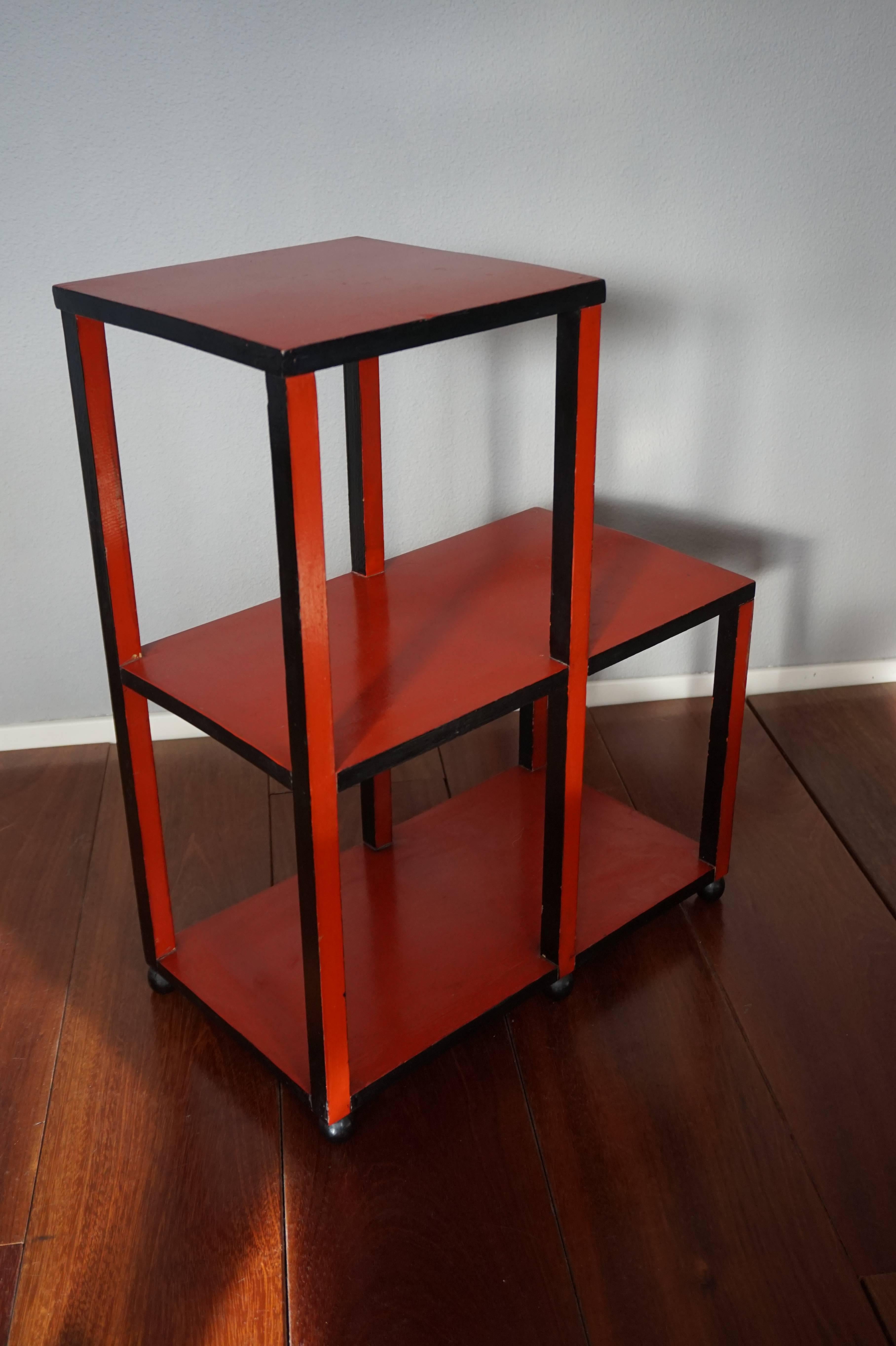 Original 1920s Art Deco display table.

If you have an eye for the rare and original then this little, avantgardistic etagere/stand from the early twenties will grab your attention. This angular, wooden table is lacquered on all sides and the