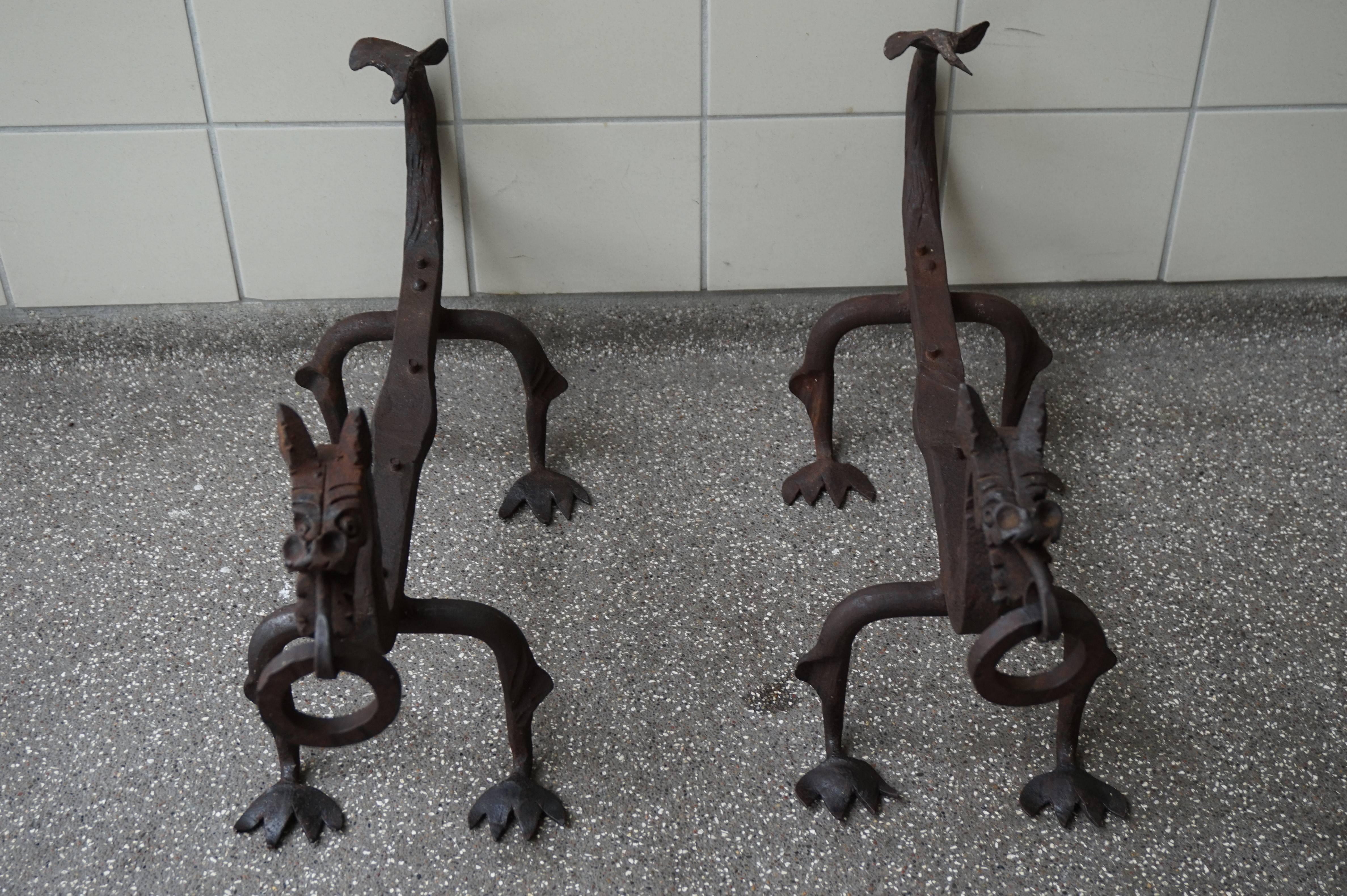 Imagine these in your fireplace with the flames burning on all sides.

These beautifully and all handcrafted wrought iron, andirons were made to stand in your fireplace as in image number 2. The idea is to put your loggs on top so that the fire will