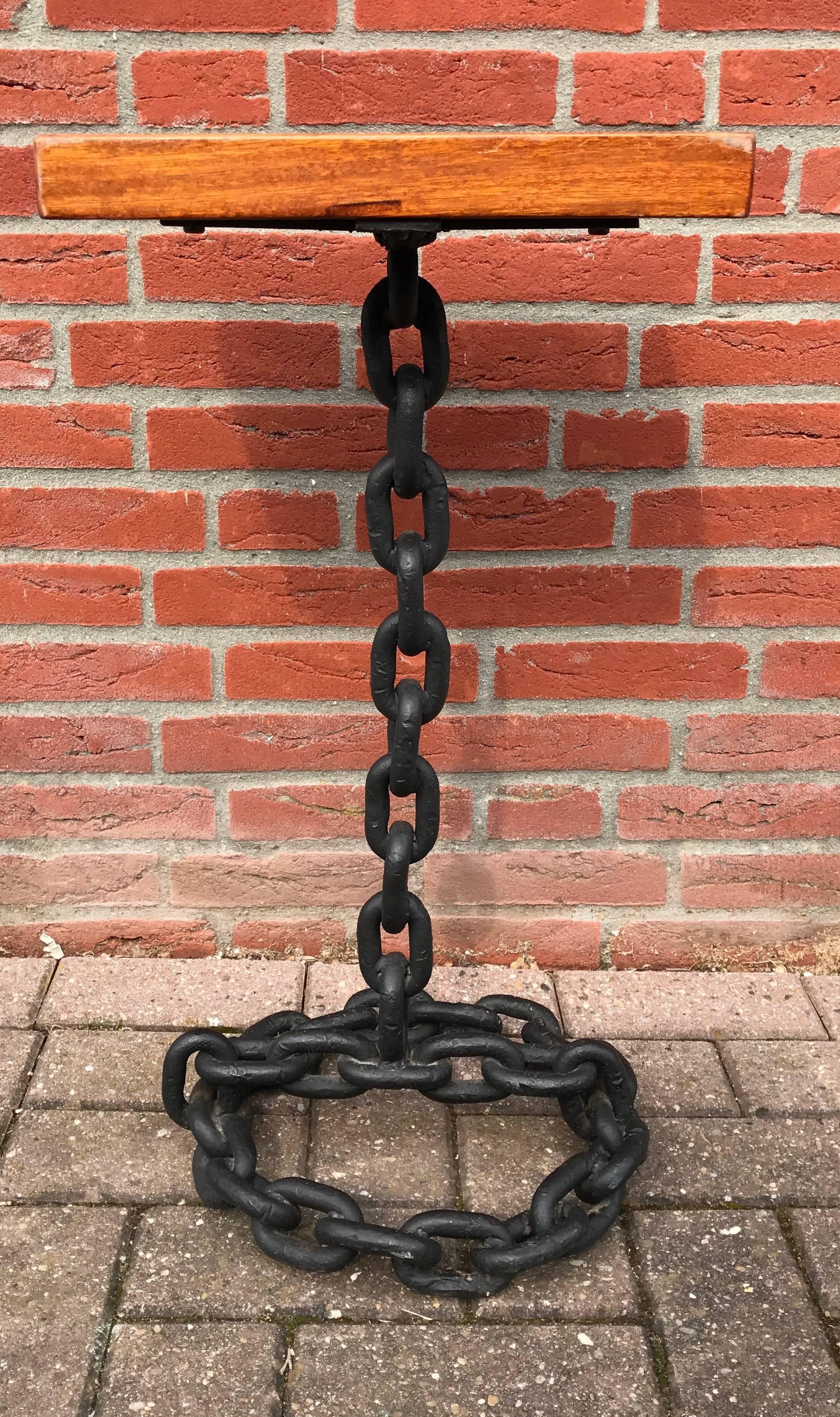 Rare and decorative metal chain table in the style of Franz West (1947-2012).

This one is for the lovers of art and unusual design with a practical purpose. This nautical theme stand of iron and wood creates a bit of an optical illusion. Anyone who