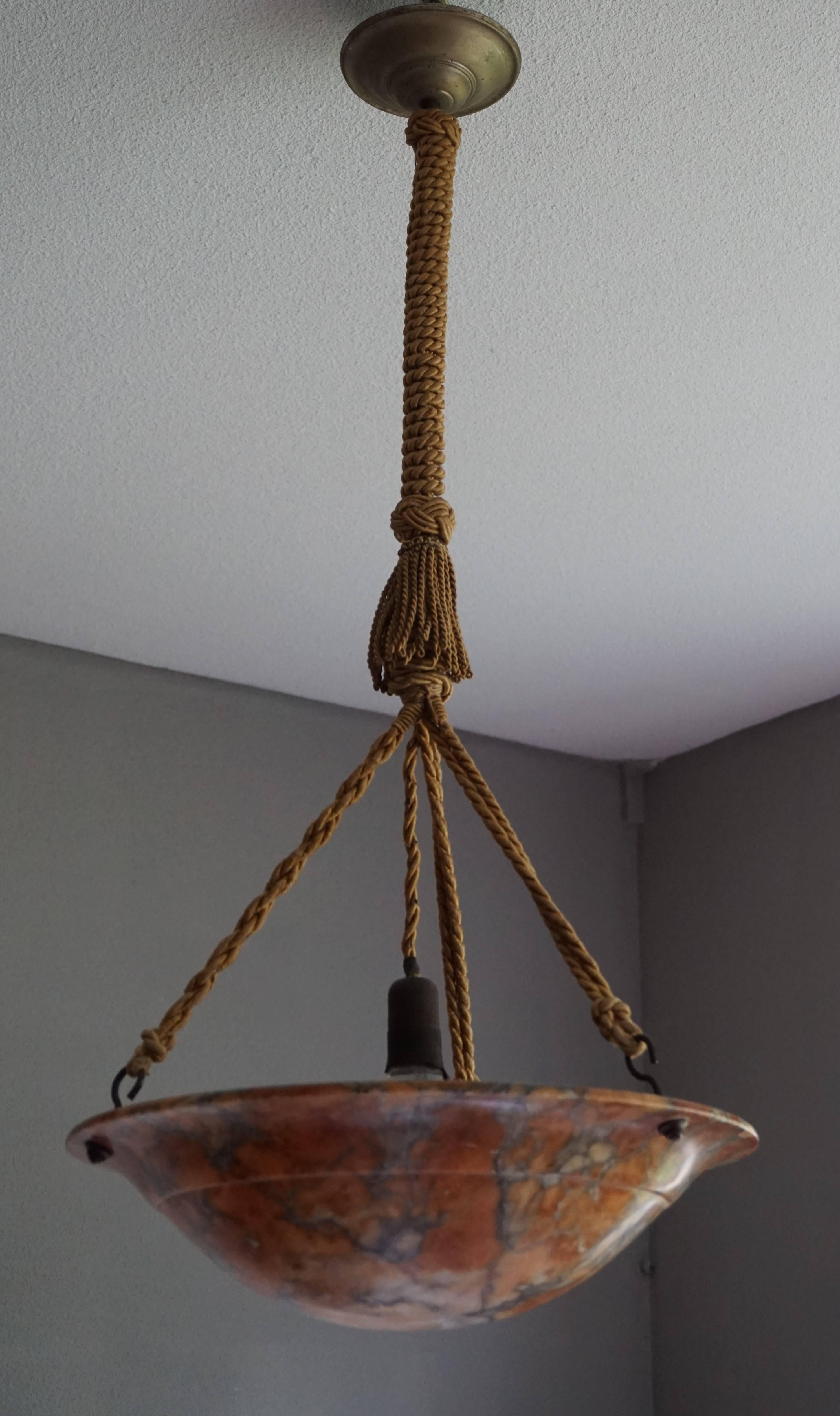 Great shape and color alabaster pendant.

If you are looking for a good quality and condition pendant then this striking example could be the one or you. This practical size alabaster shade comes with the Original rope and the combination of the two
