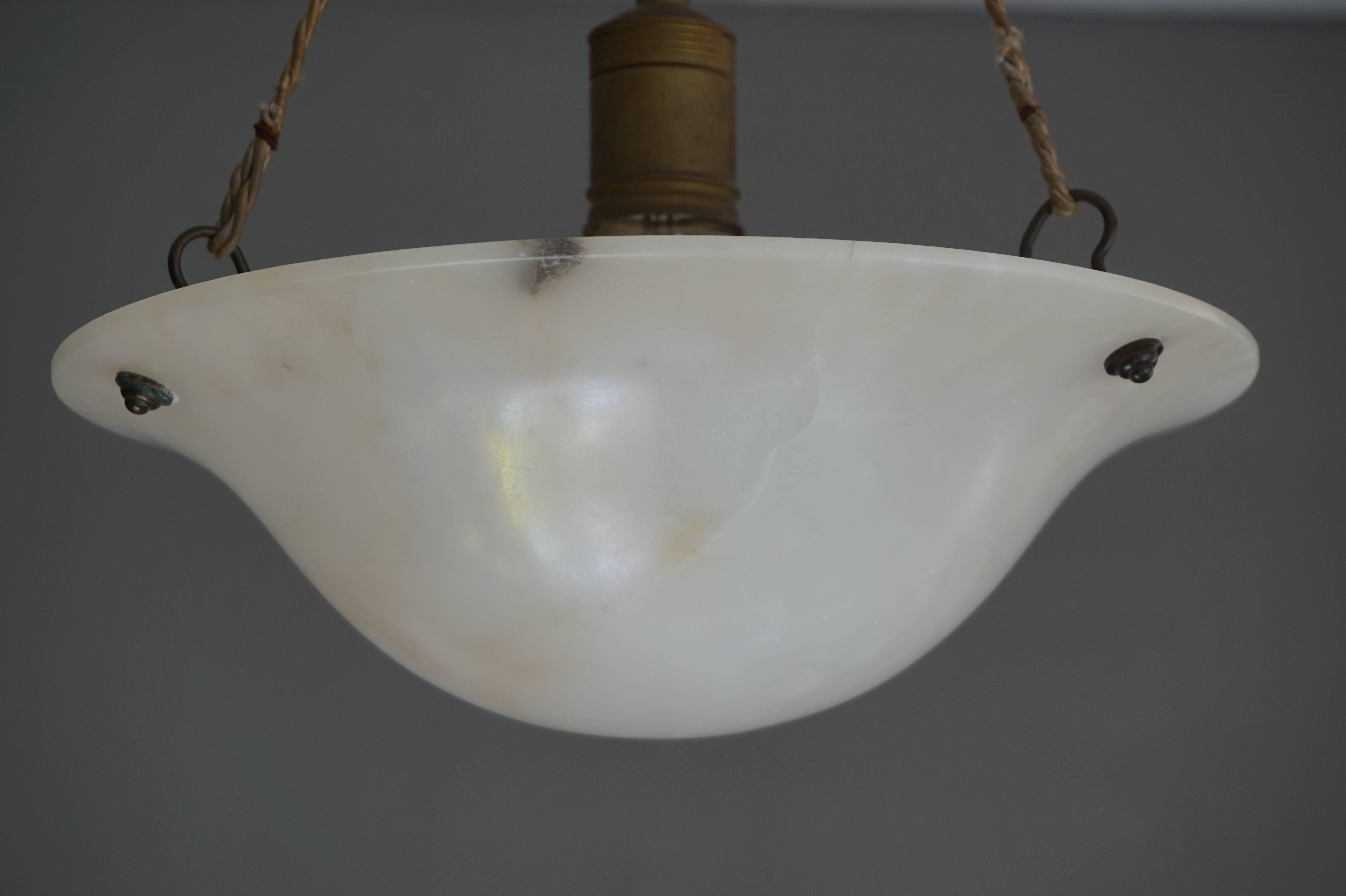 Rare size alabaster pendant for an entrance, small room or corner.

This relatively small size pendant is completely original and the alabaster shade is in good to excellent condition (see all pictures). This fine antique looks great both on and off