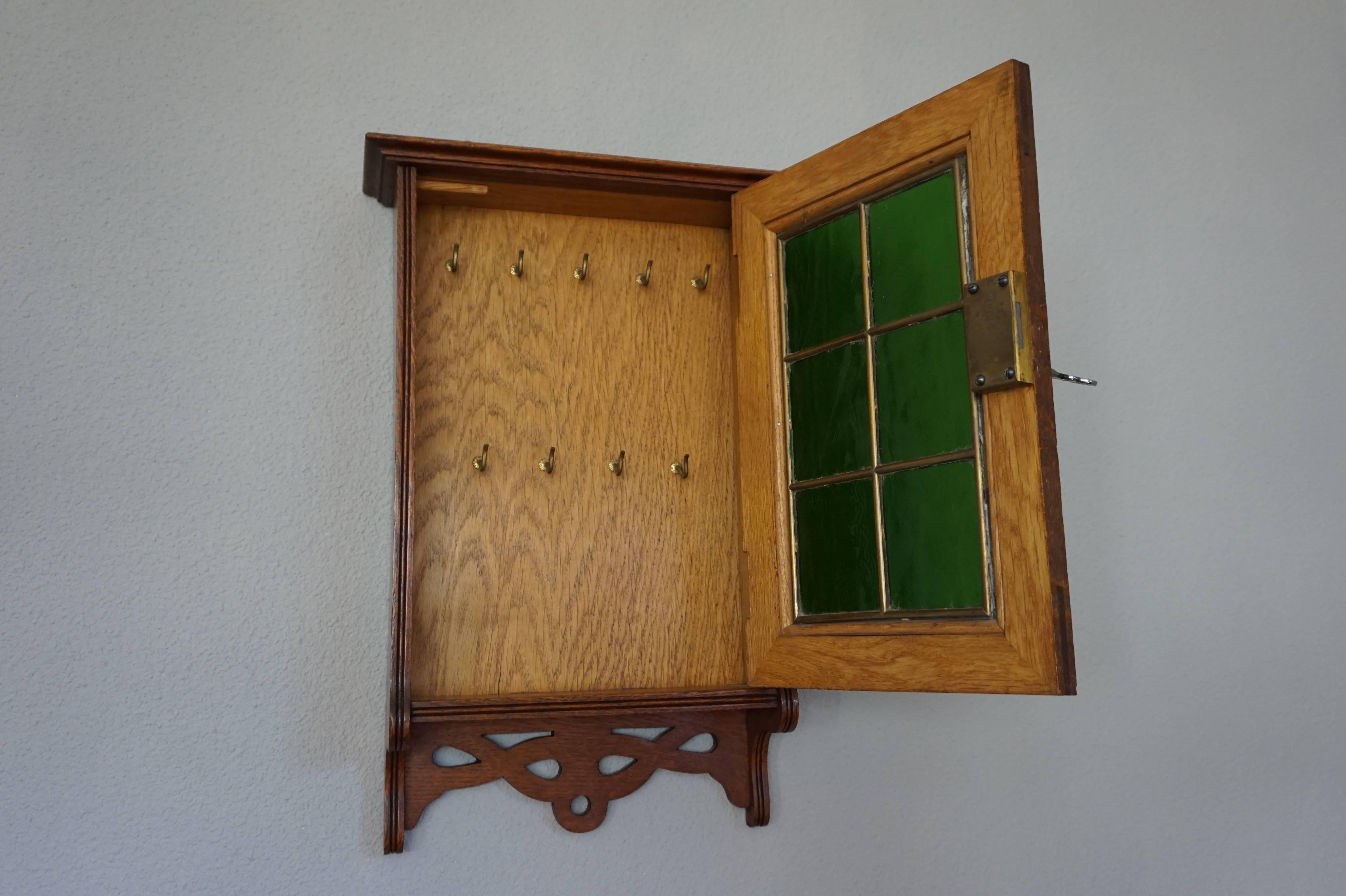 19th Century Stunning Little Arts and Crafts Wall Cabinet for Keys with Brass and Green Glass