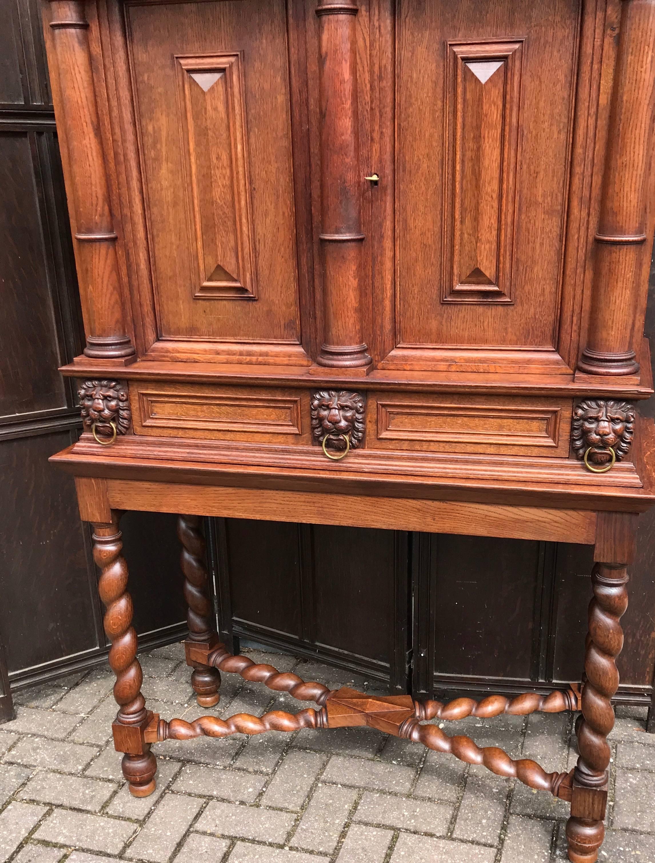 Practical size and beautiful quality cupboard with hidden drawer.

This handcrafted and solid tiger oak cabinet is in very good condition. We cannot find a makers name, but this is most certainly the work of a skilled cabinet maker. This impressive