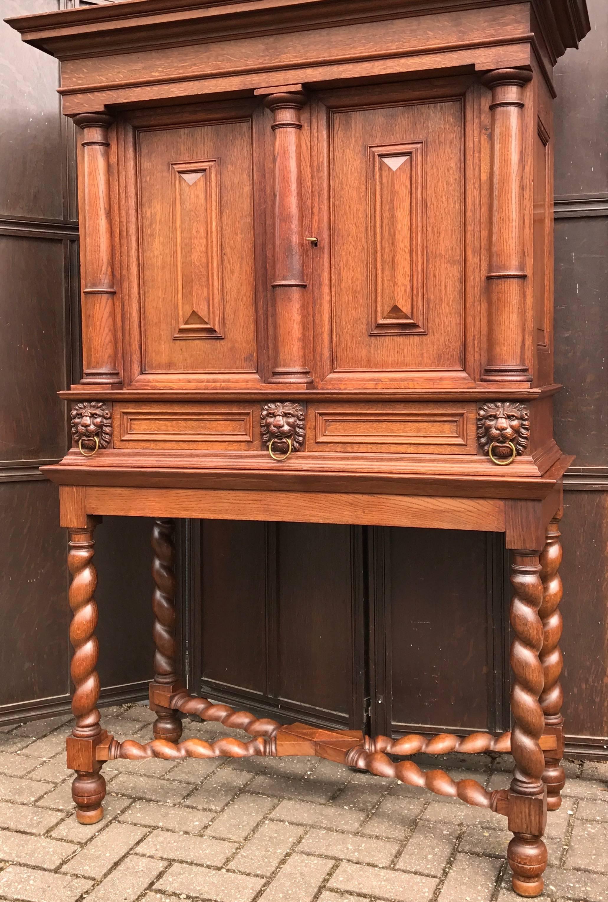 Dutch Stunning Baroque Revival Tiger Oak Cabinet with Lion Heads and Barley Twist Base For Sale