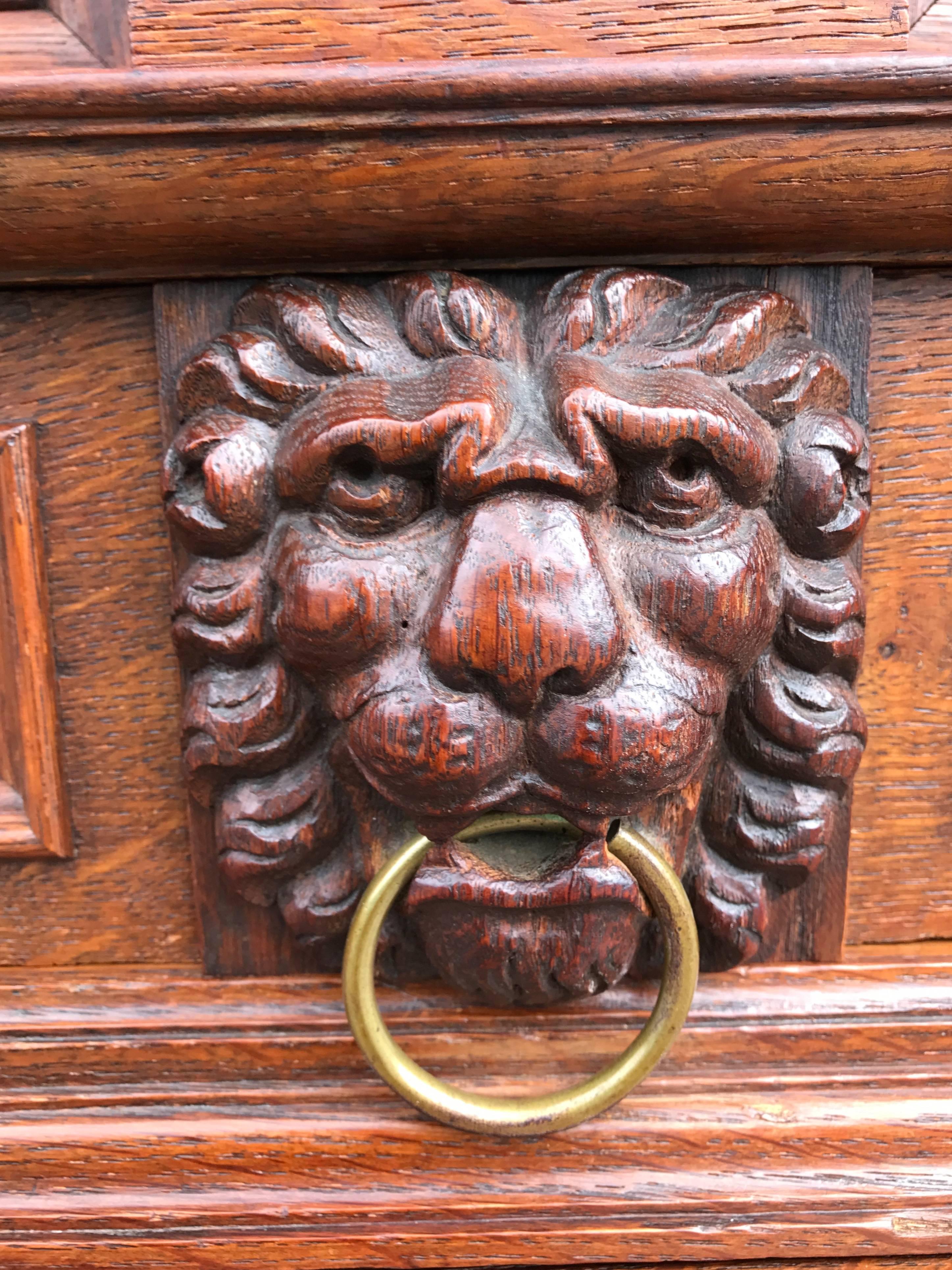 Hand-Carved Stunning Baroque Revival Tiger Oak Cabinet with Lion Heads and Barley Twist Base For Sale